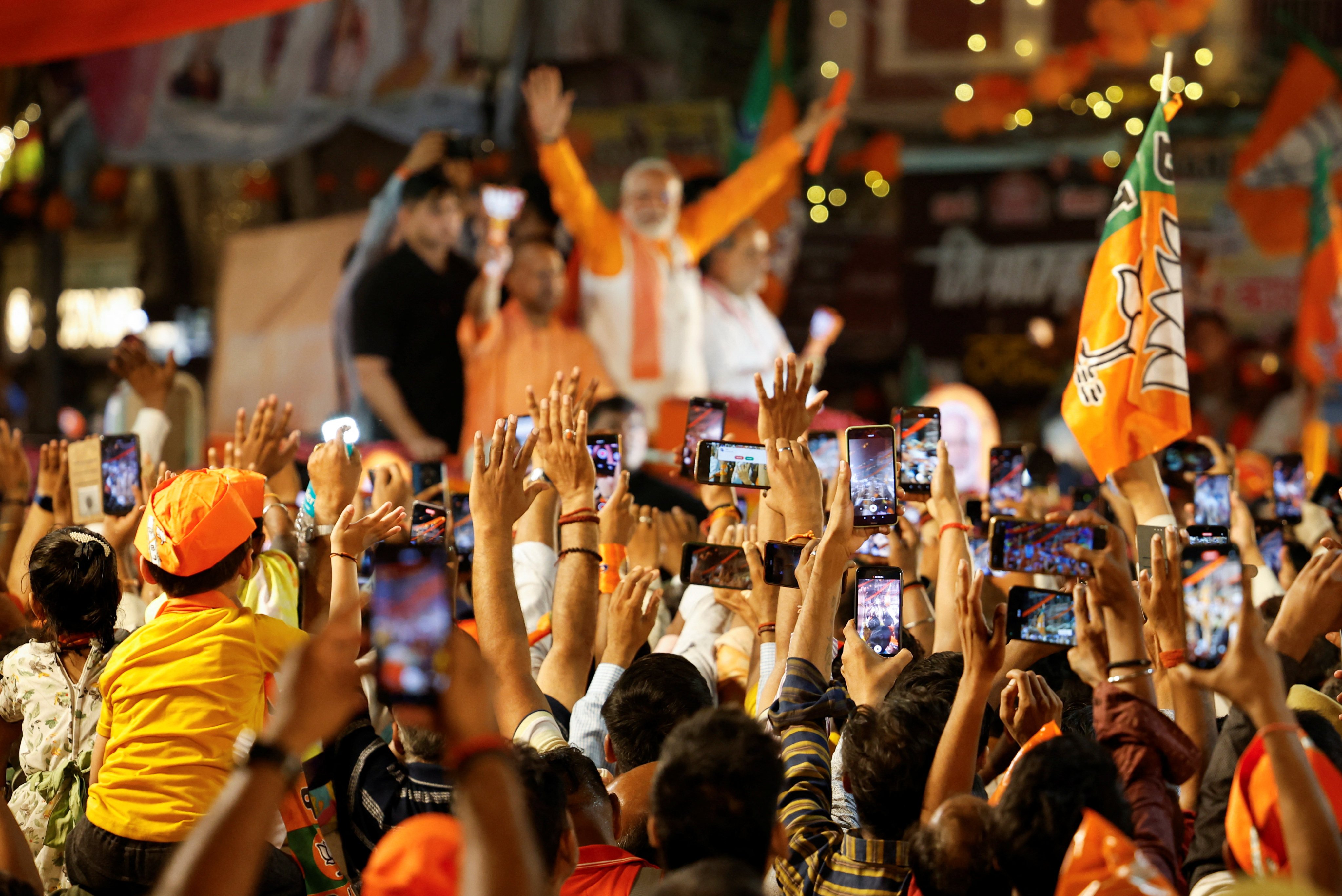 Supporters use their smartphones to take pictures of India’s Prime Minister Narendra Modi during an election roadshow for his ruling Bharatiya Janata Party in Varanasi on May 13. Photo: Reuters