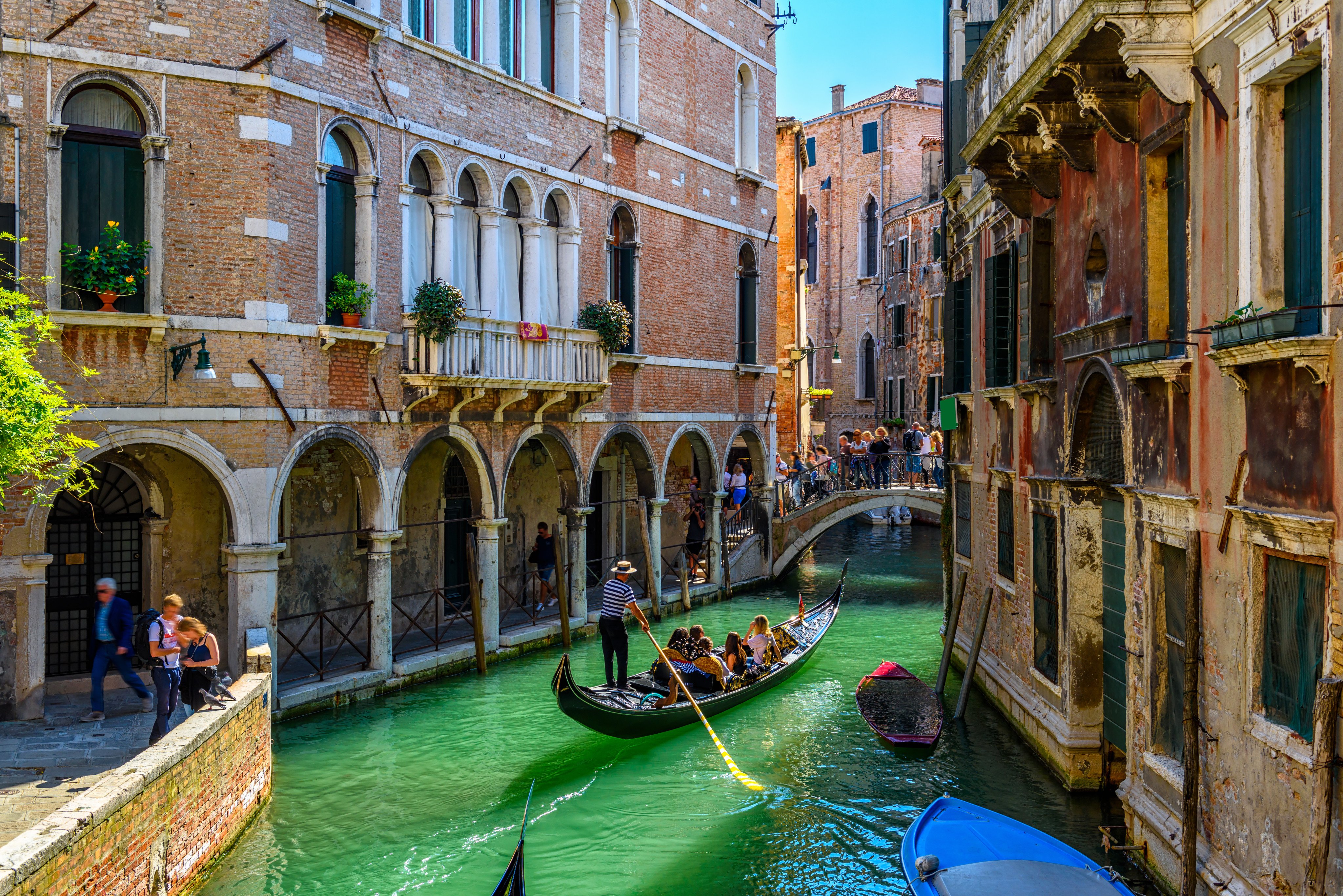A gondola traverses a canal in Venice. Photo: Shutterstock