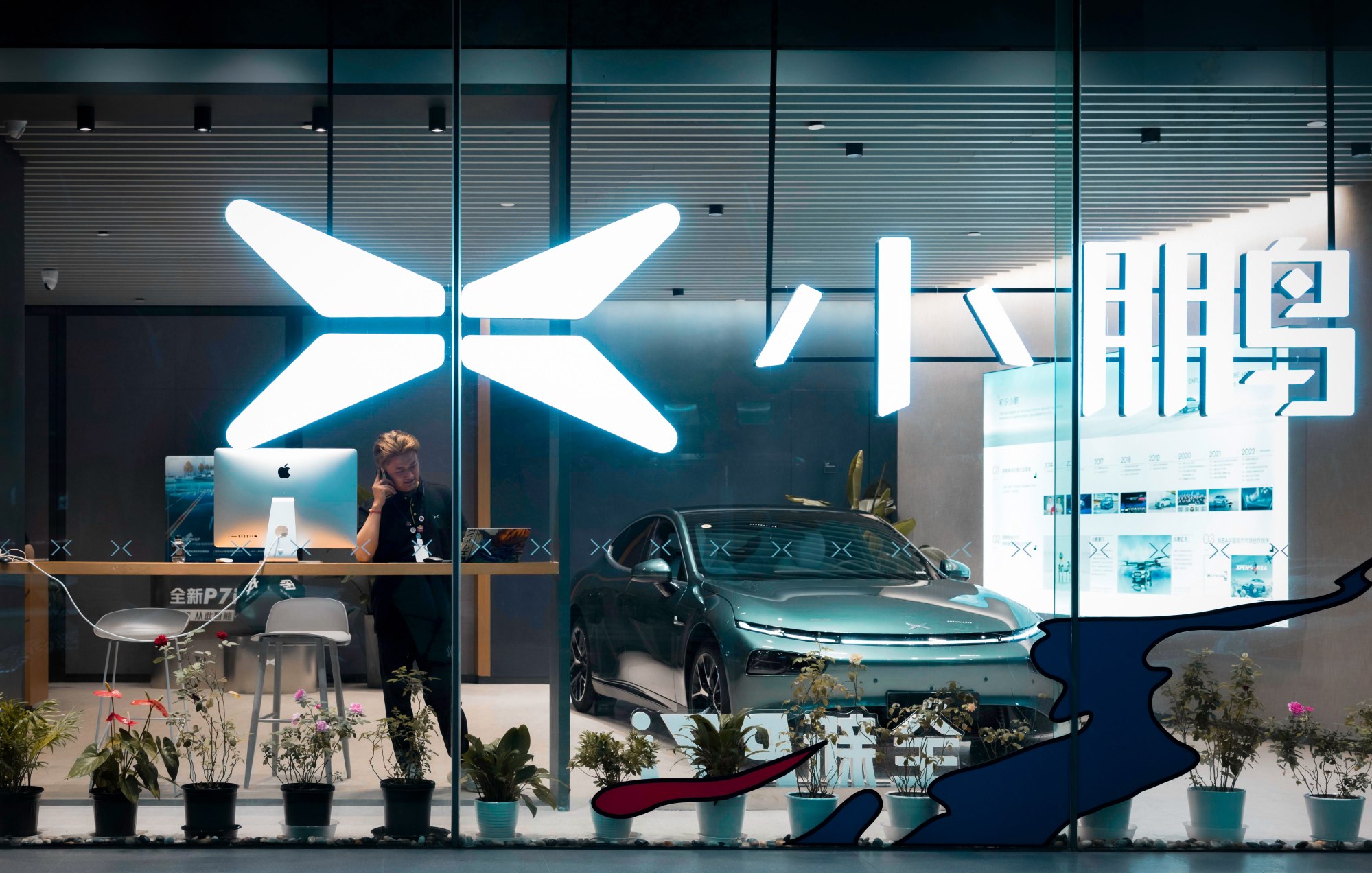 A shop of Chinese electric vehicle manufacturer Xpeng is seen in Shanghai in September 2023. The European Commission on 13 September launched an investigation aimed at assessing the feasibility of imposing punitive tariffs on Chinese electric vehicle (EV) imports. Photo: EPA-EFE