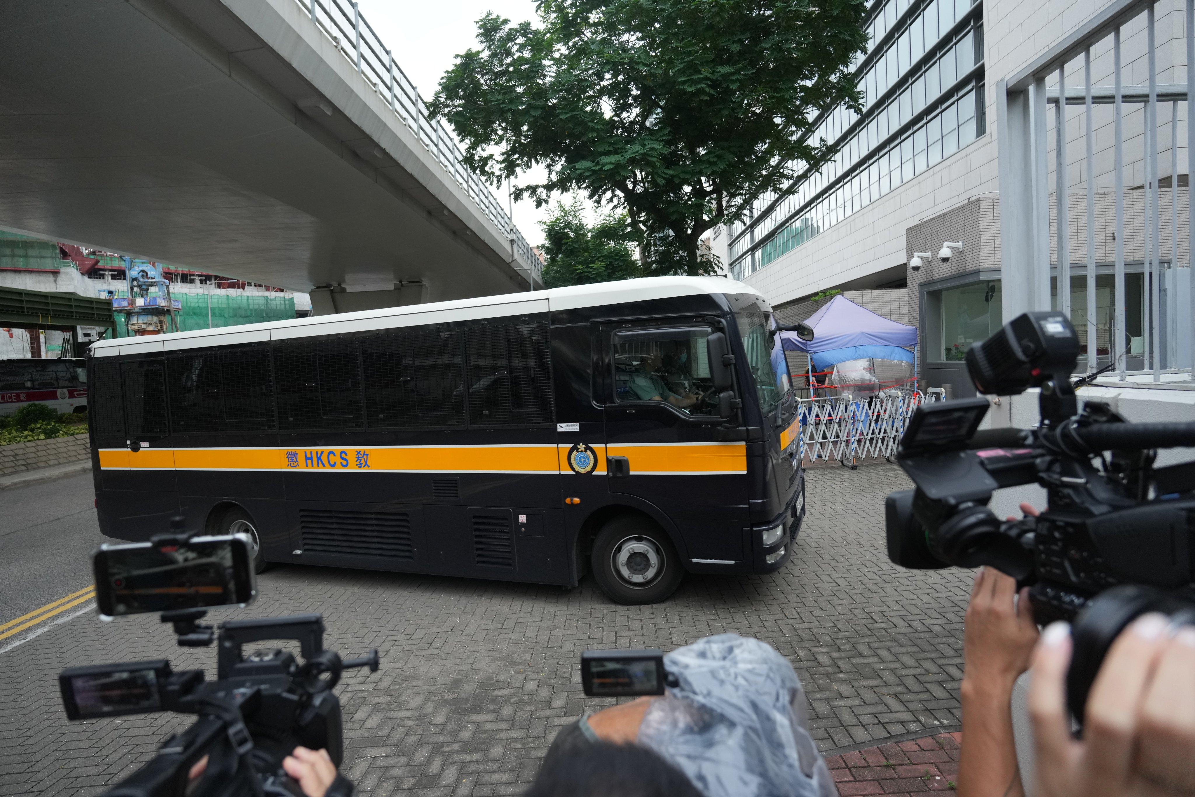 Defendants are taken in a prison vehicle to West Kowloon Court on Thursday to learn their fate. Photo: Sam Tsang