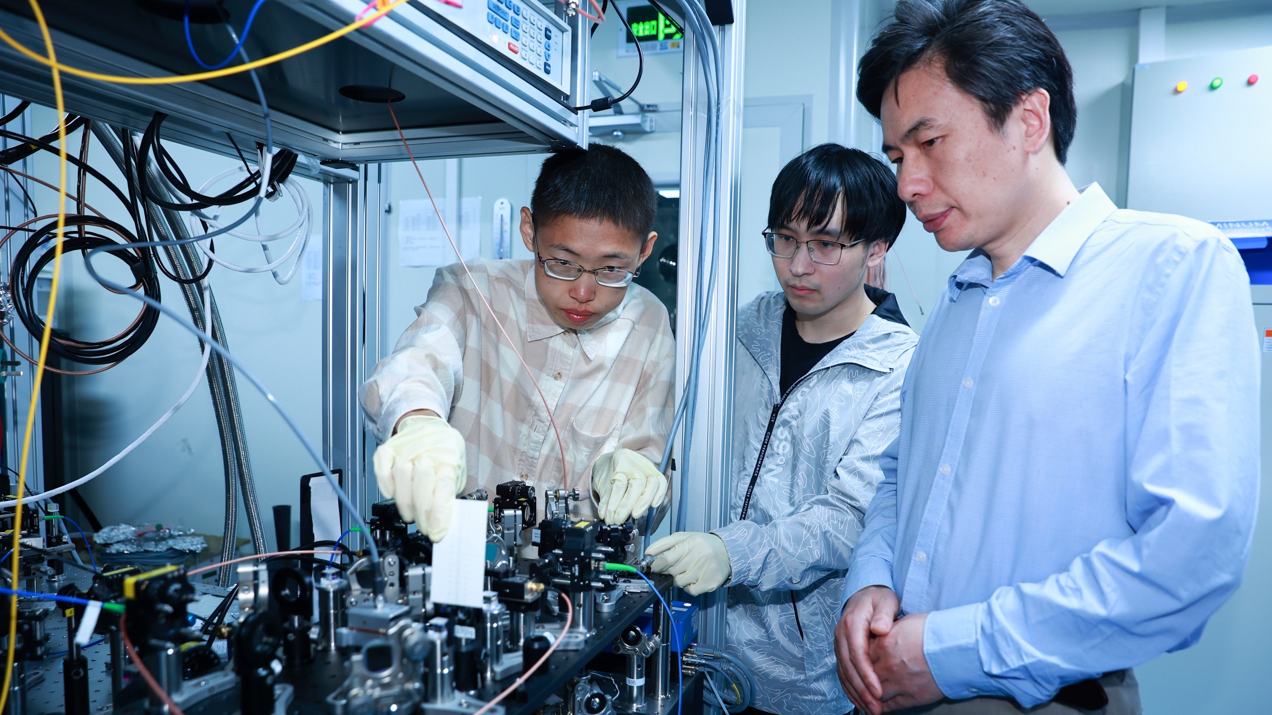 Duan Luming (right) with some members of his quantum computing research team at Tsinghua University. Photo: Handout