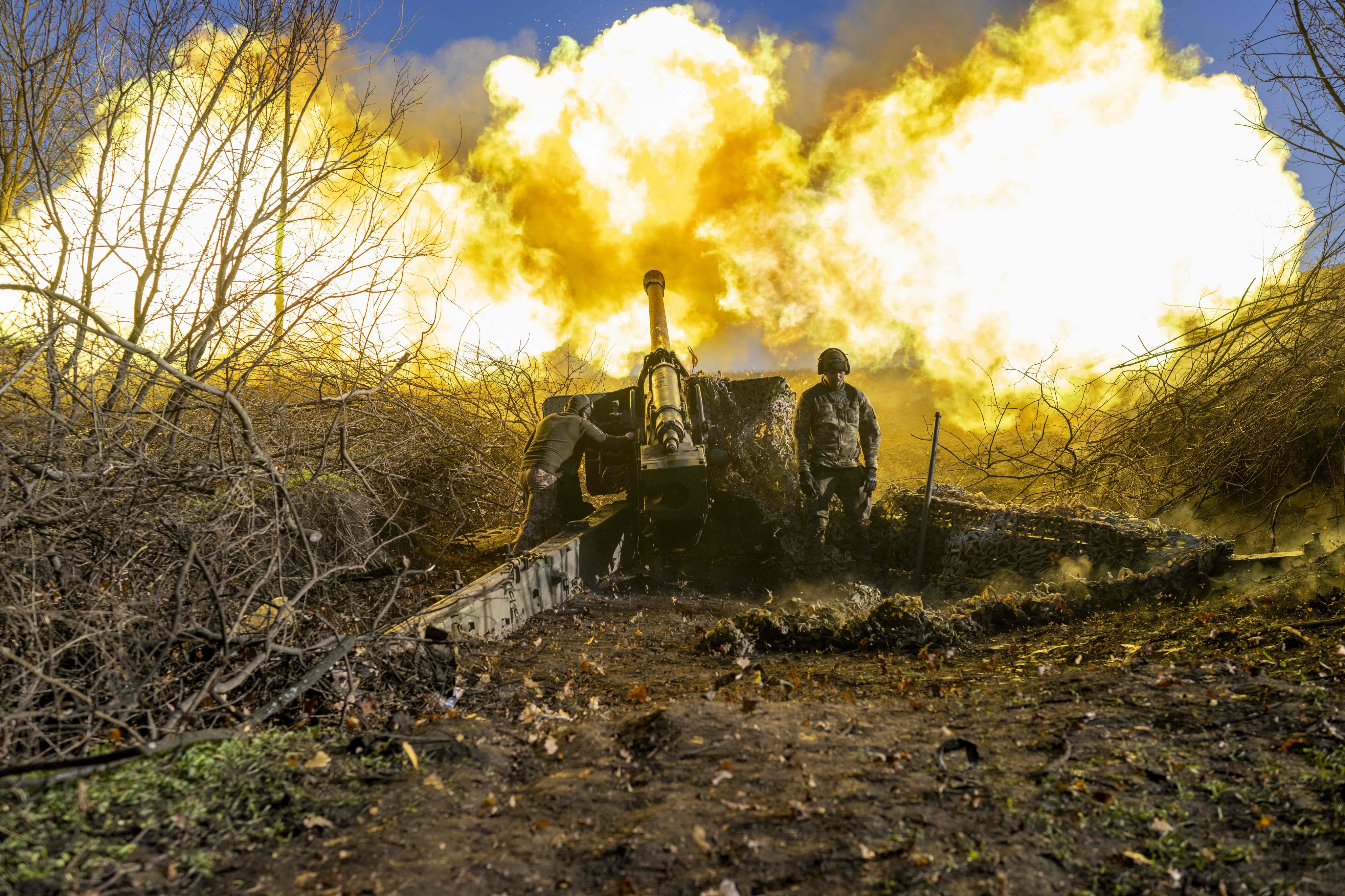 A Ukrainian soldier fires towards Russian positions outside Bakhmut, amid the Russian invasion of Ukraine. Photo: AFP