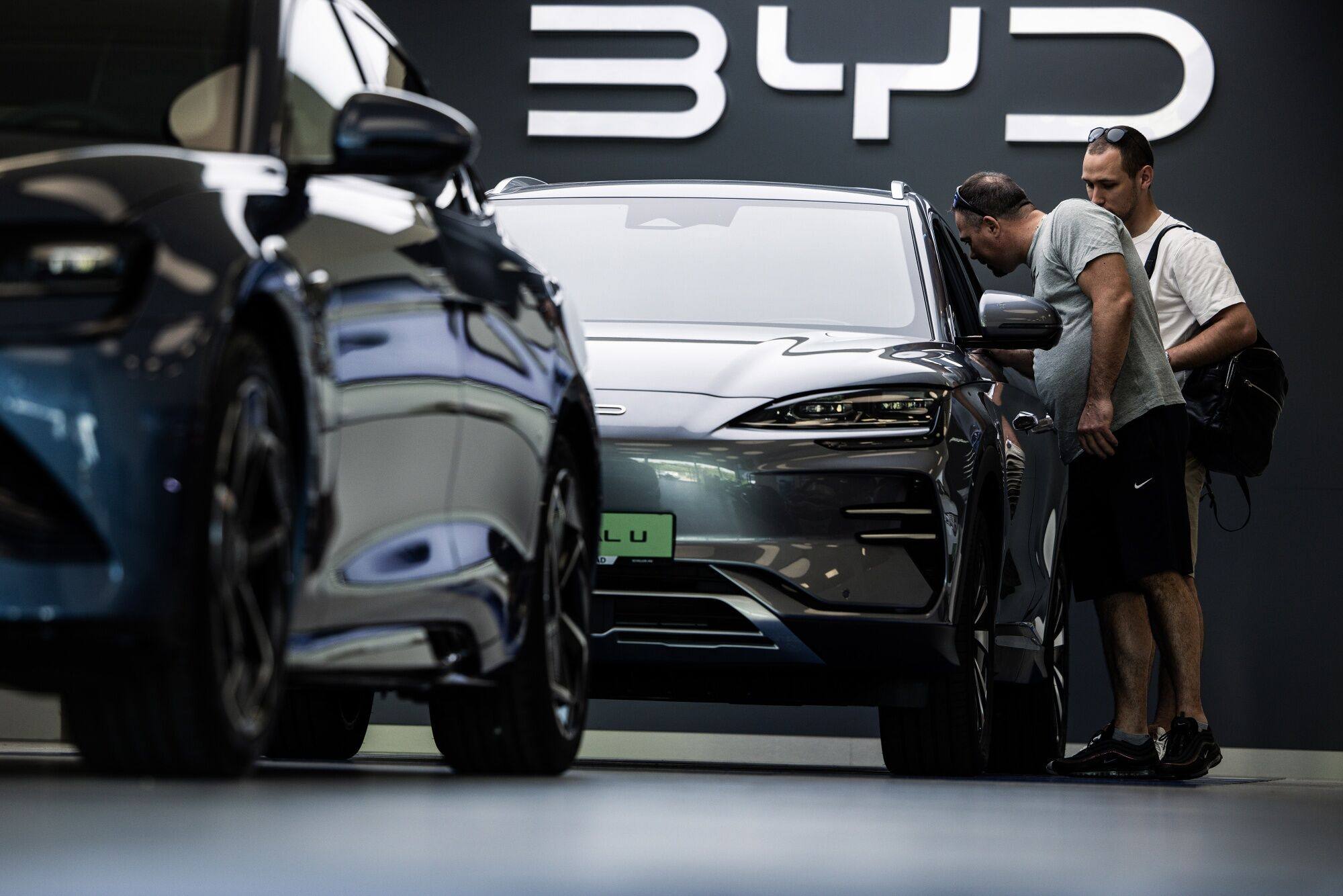 Customers check out BYD’s electric vehicles at a showroom in Budapest, Hungary on May 27. Photo: Bloomberg