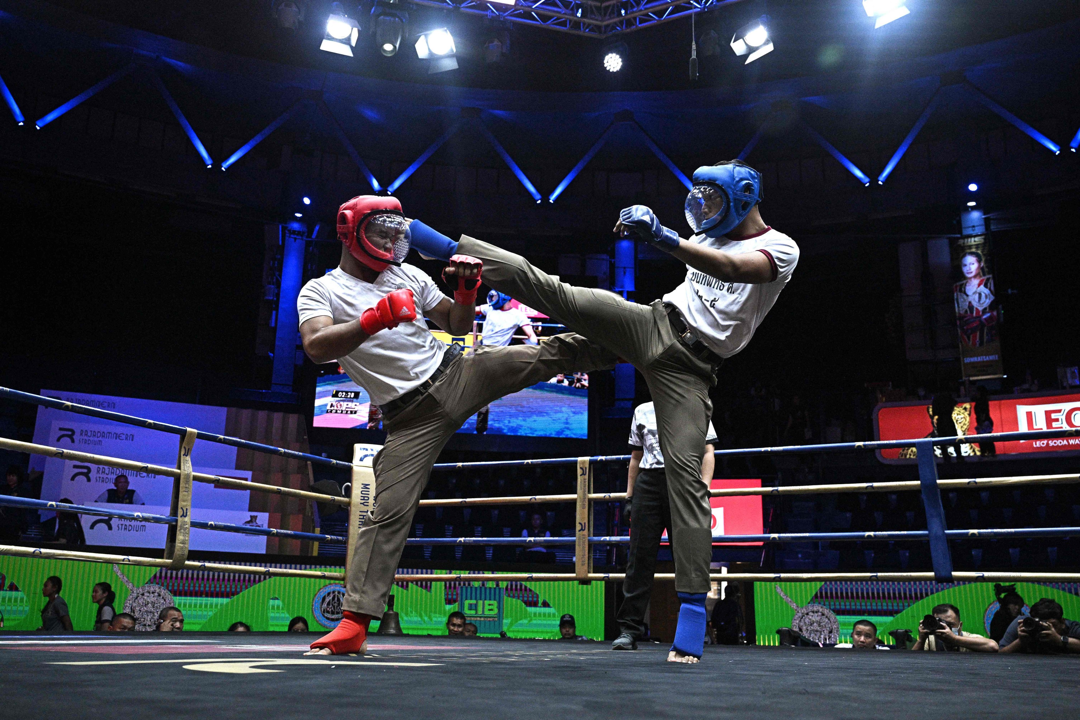 Thai police take part in “Cops Combat,” Thailand’s first martial arts tournament for members of the Royal Thai Police in Bangkok on May 28. Photo: AFP