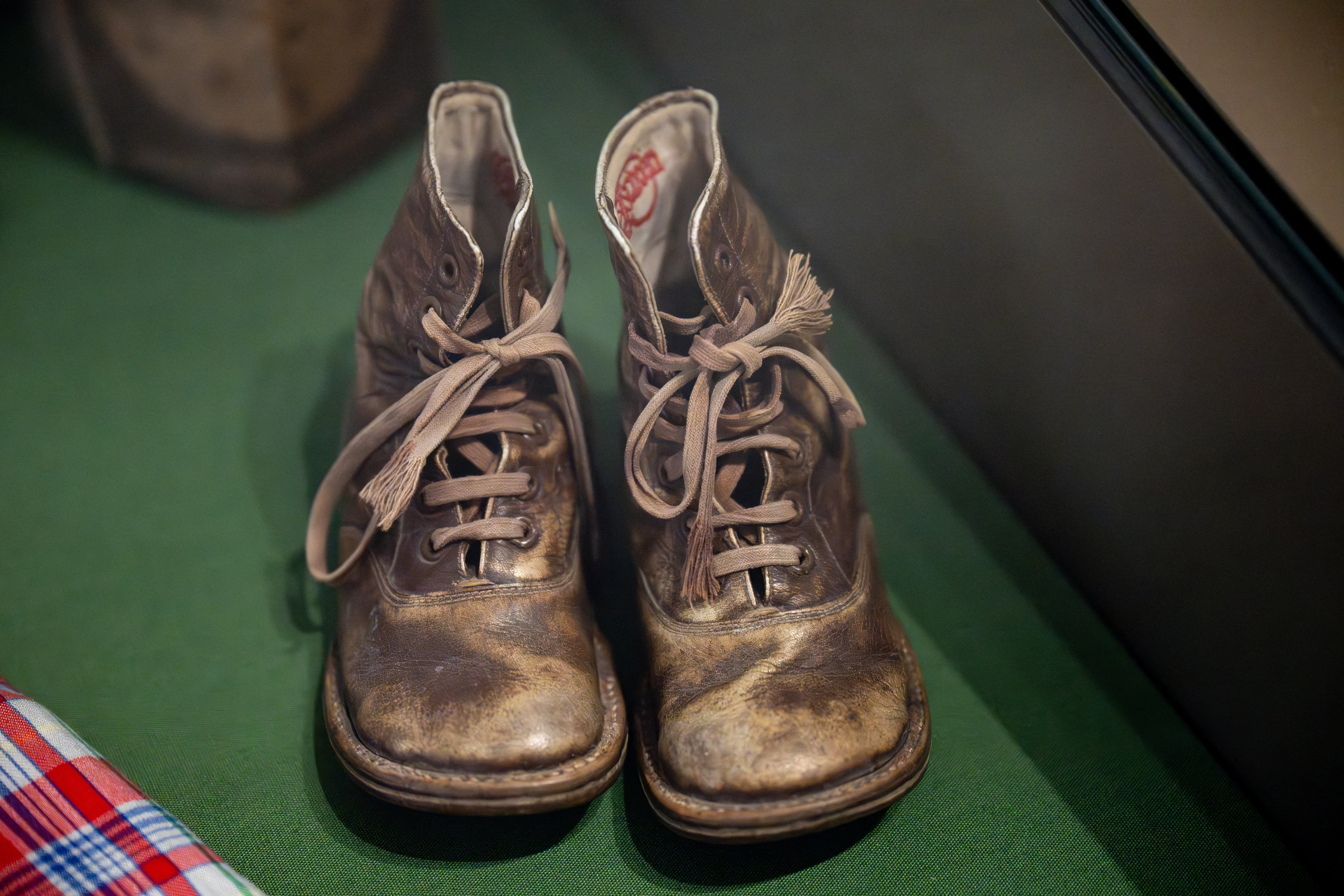 The pair of shoes Holocaust survivor Roosje Steenhart-Drukker was wearing as a two-year-old when her Jewish parents left her, hoping she would be found, on display at the Holocaust Museum in Amsterdam as part of an exhibition about Nazi Germany’s occupation of the Netherlands. Photo: AFP