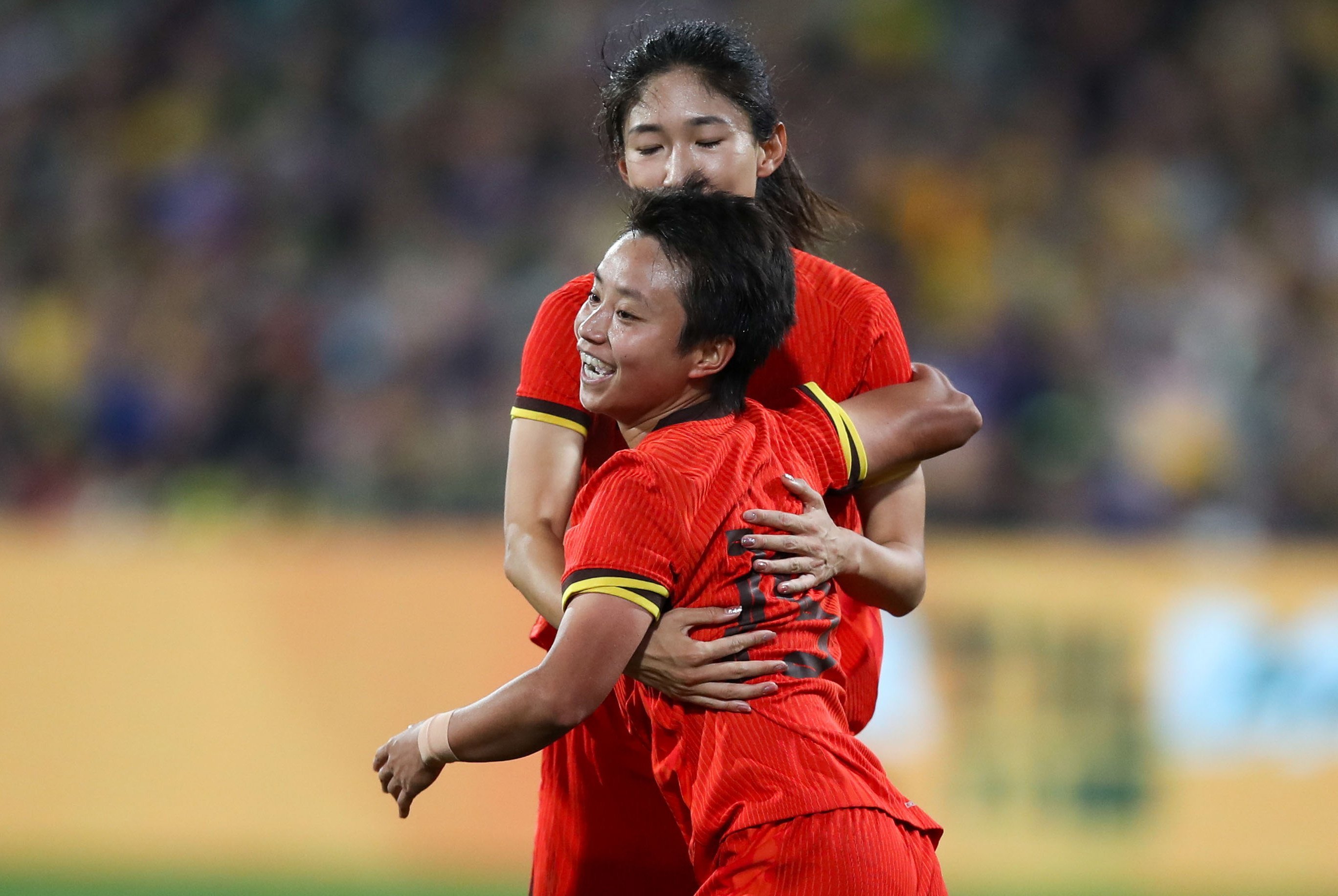 China’s Linyan Zhang celebrates after her goal opened the scoring in the friendly with Australia. Photo: EPA