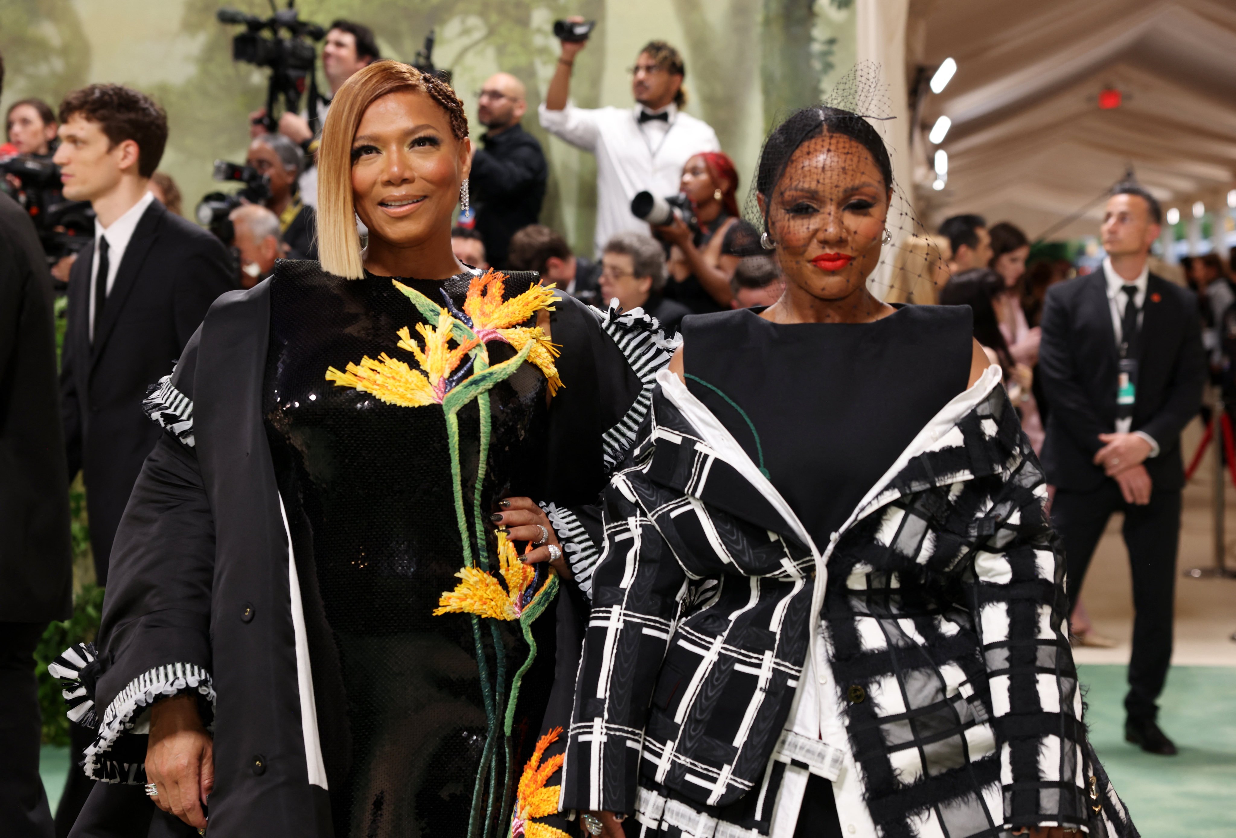 Queen Latifah and Eboni Nichols pose in complementary black outfits at the 2024 Met Gala in New York. Photo: Reuters