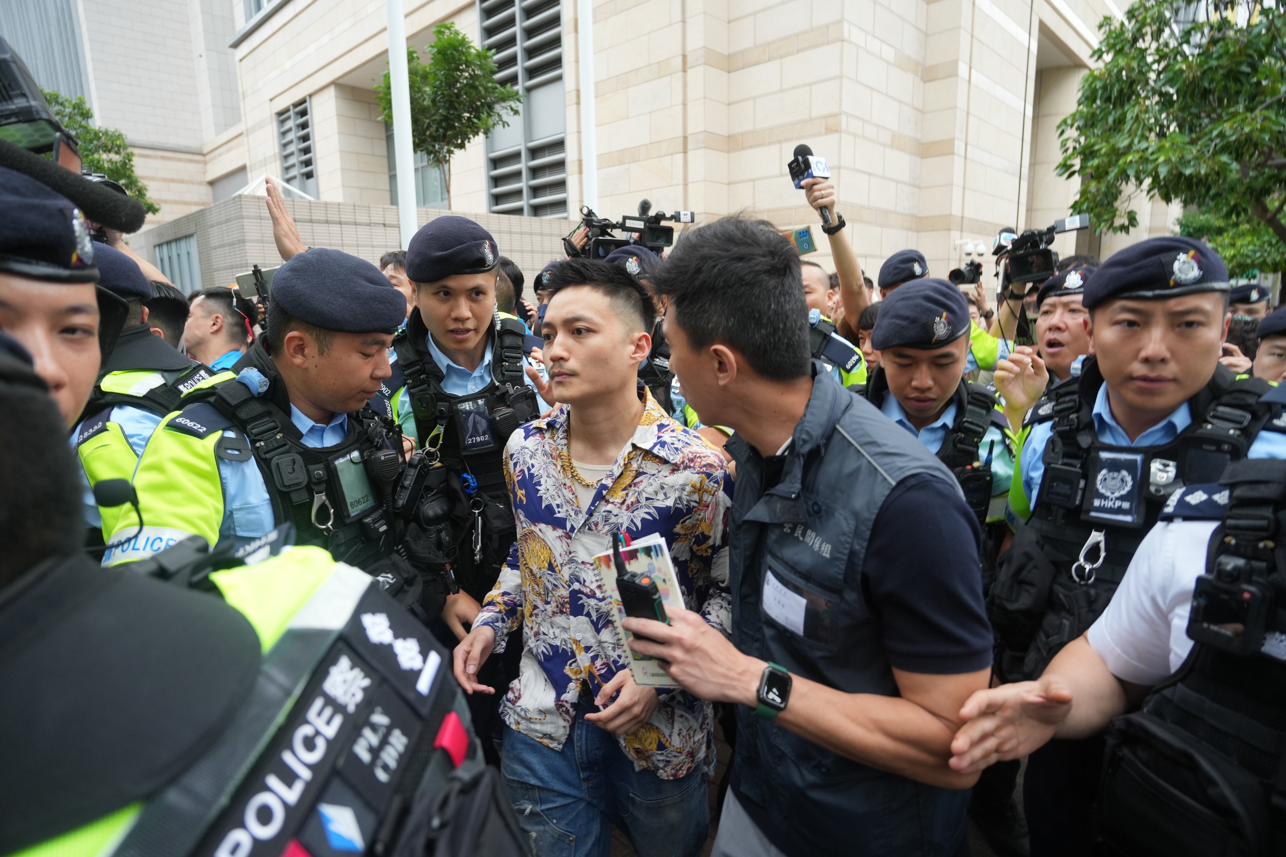 Acquitted defendant Lee Yue-shun leaves West Kowloon Court after judges handed down a verdict on Thursday. Photo: Sam Tsang