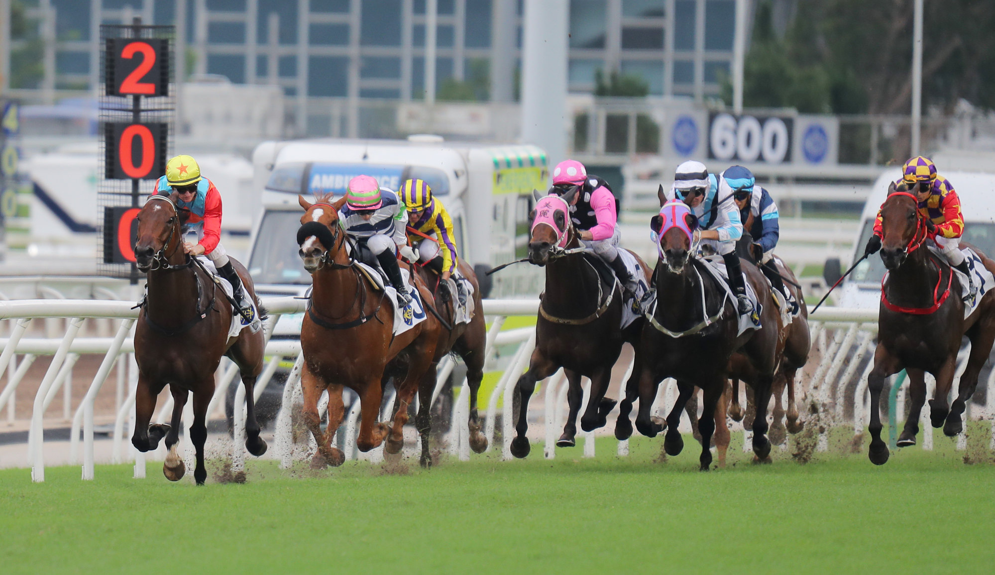 Ka Ying Rising (left) surges clear of his rivals under Zac Purton.