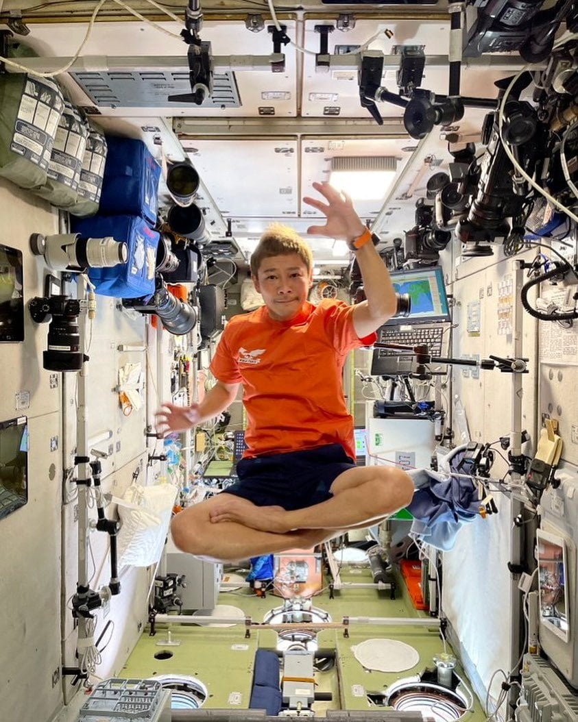 Japanese billionaire Yusaku Maezawa floats inside the International Space Station in 2021. Photo: Reuters