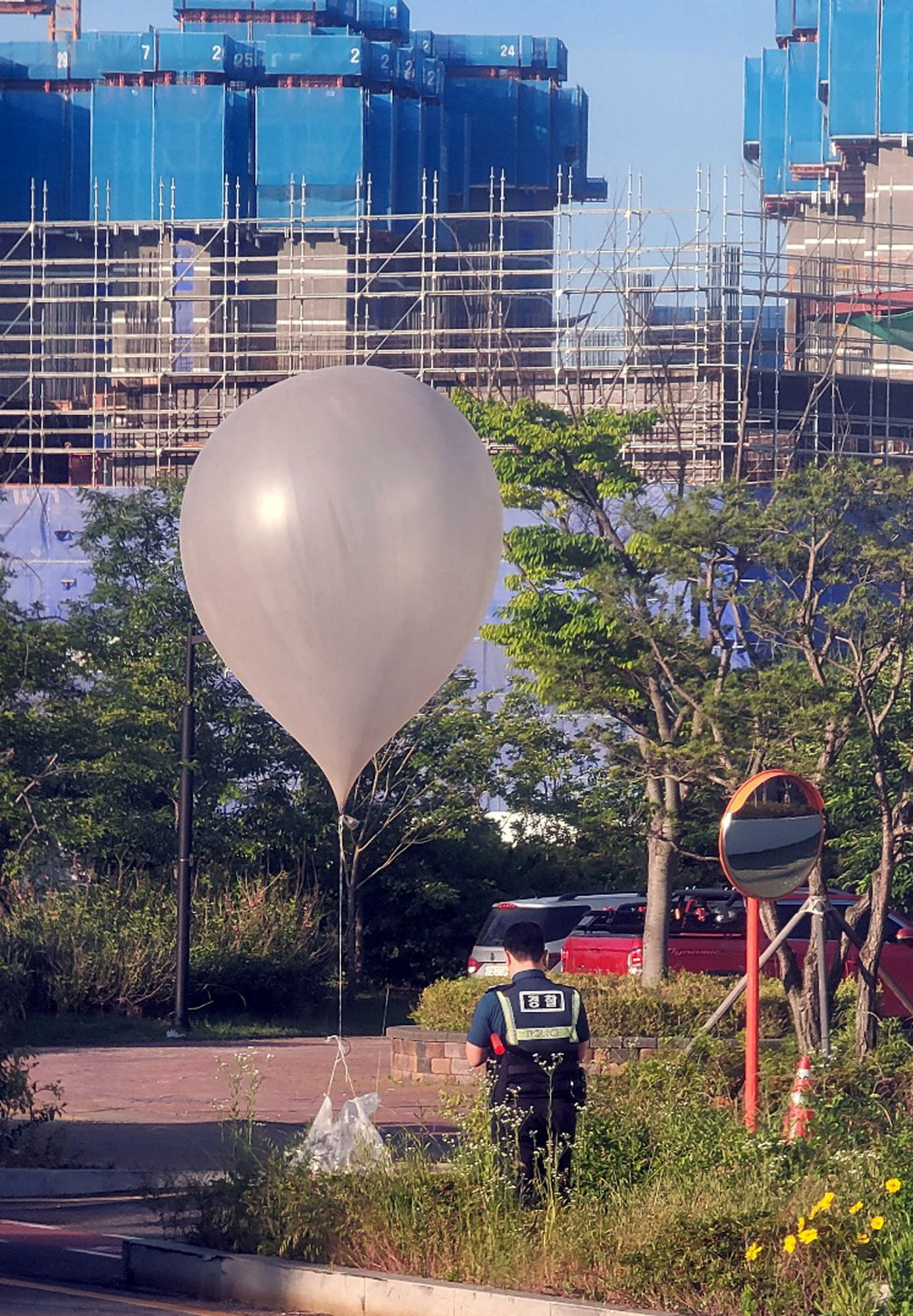 A balloon believed to have been sent by North Korea, carrying various objects including what appeared to be rubbish, is pictured at a park in Incheon, South Korea, on Sunday. Photo: Reuters