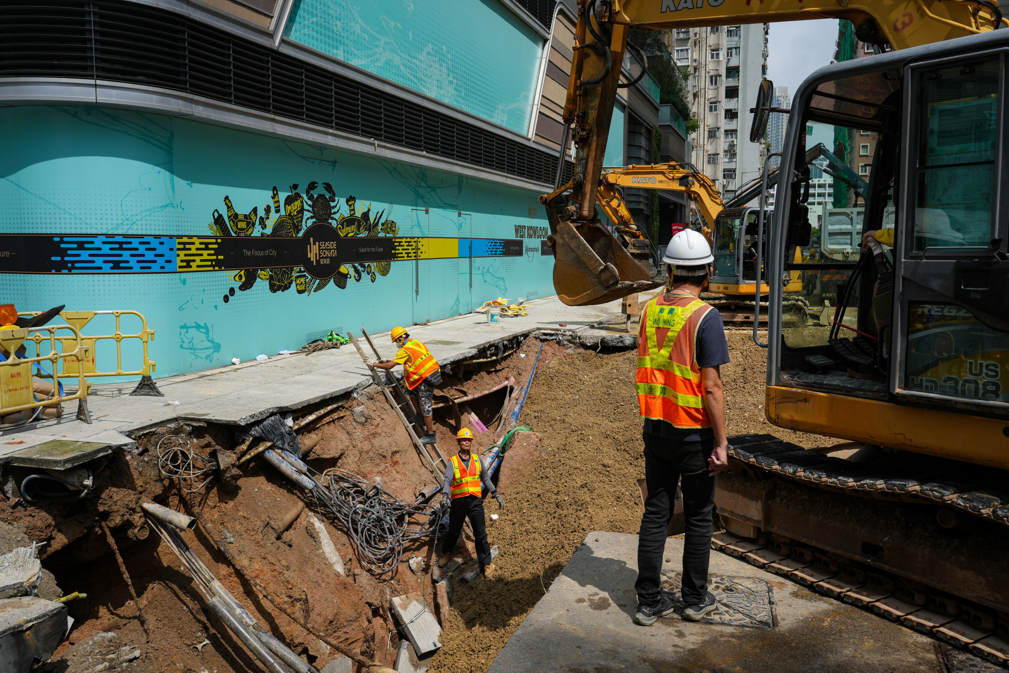 Busy Hong Kong intersection partially reopens after road subsidence ...