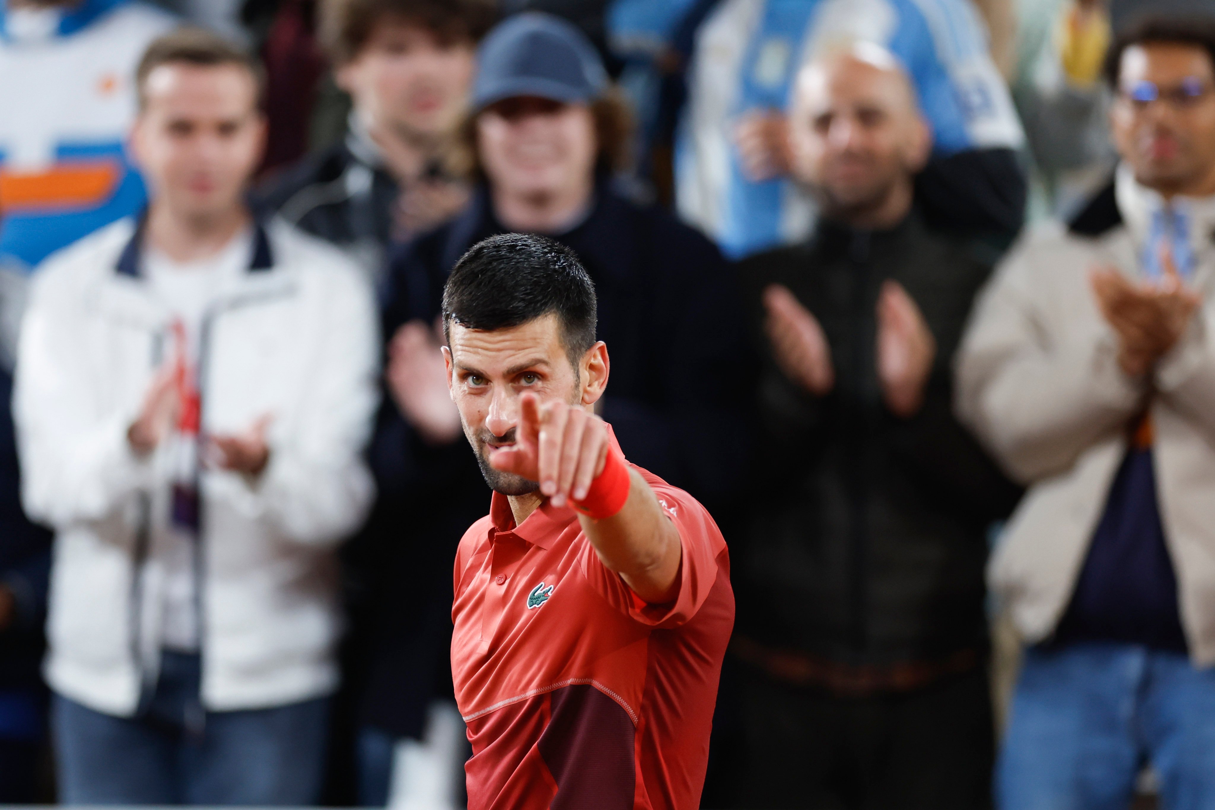 Serbia’s Novak Djokovic celebrates winning his third round men’s singles match against Italy’s Lorenzo Musetti at the French Open. Photo: AP