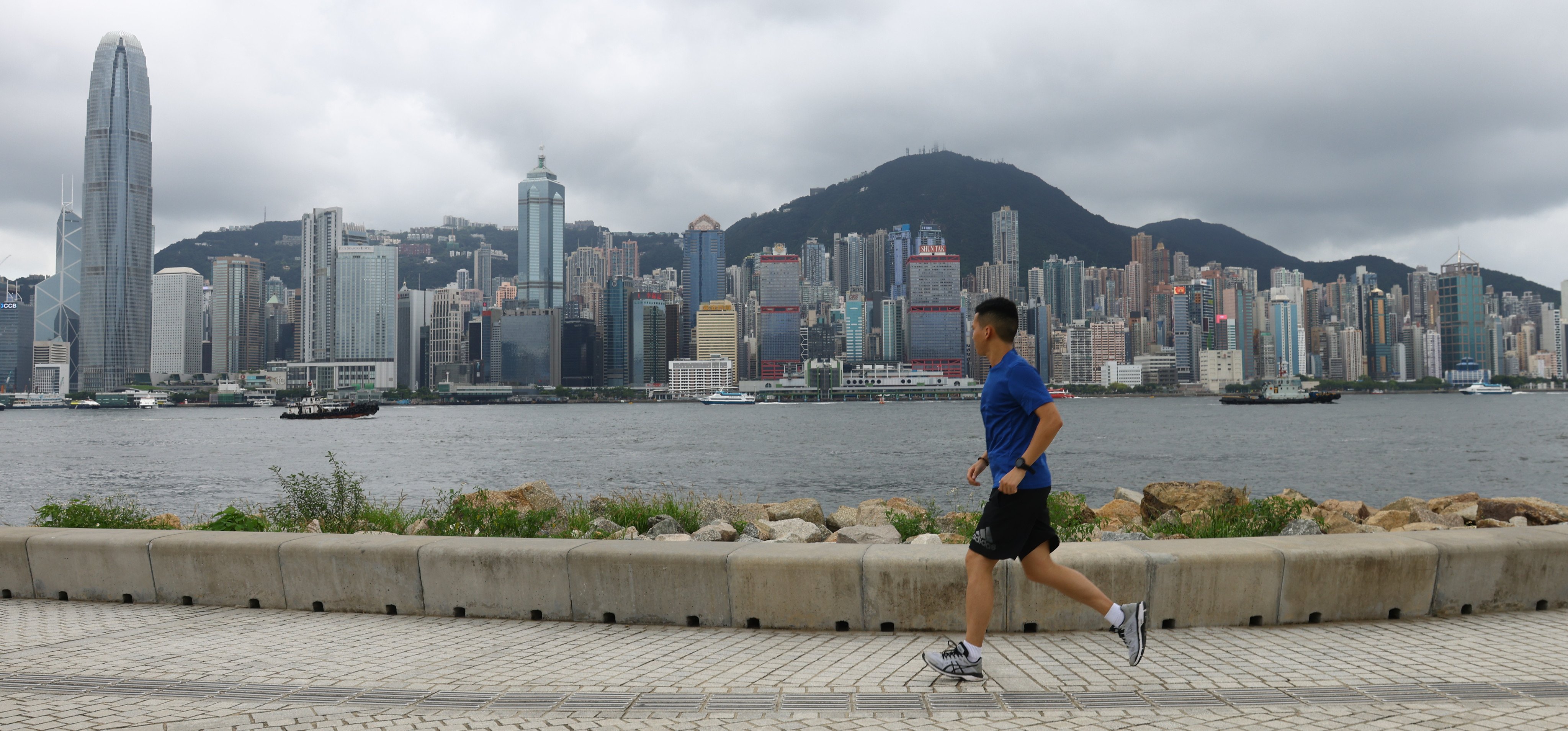 A jogger runs along the waterfront at West Kowloon Cultural District on June 23, 2023. While shoe technology has made vast progress, many of the innovations are aimed more at high-performing runners instead of the general public. Photo: Dickson Lee