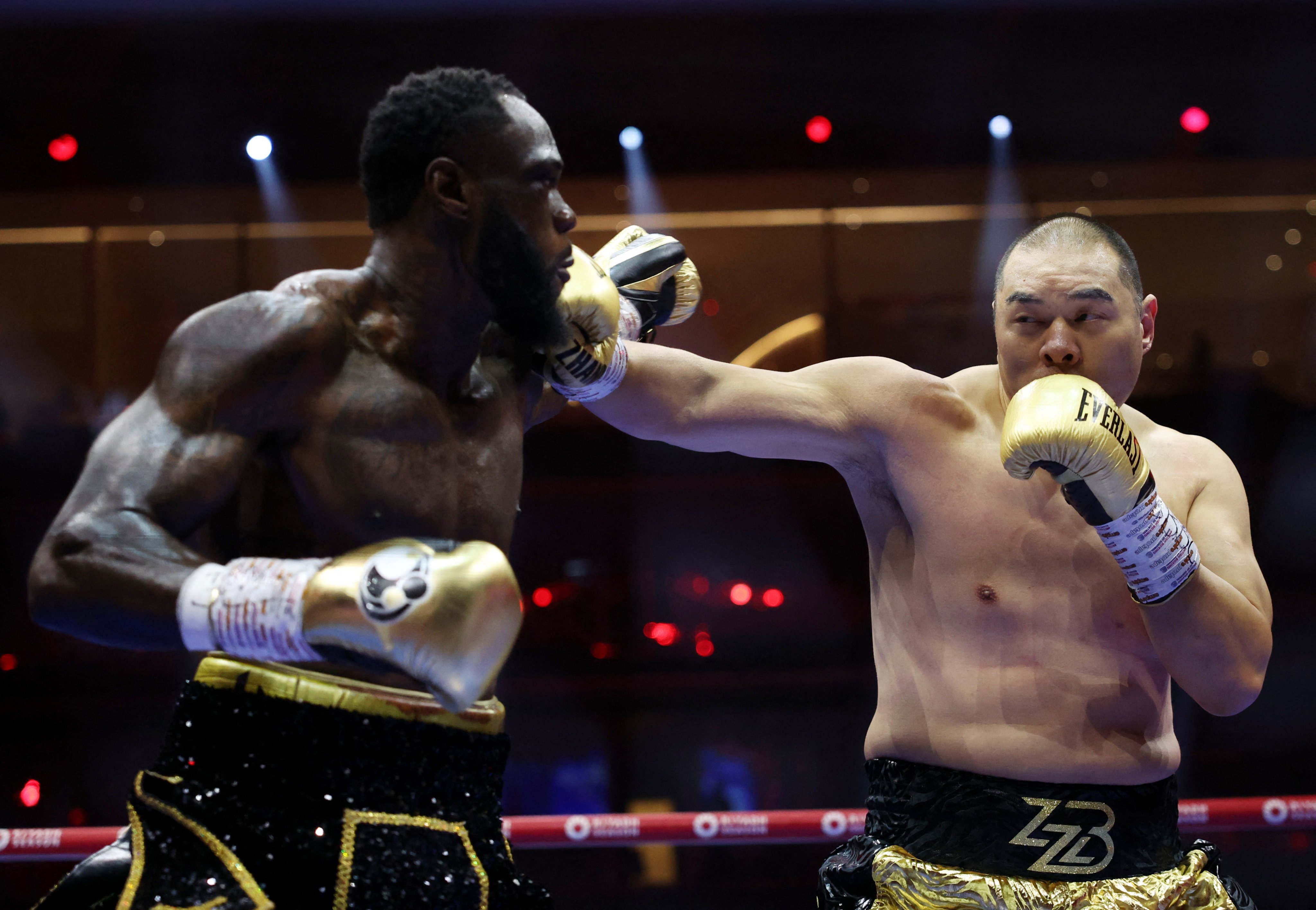 Zhang Zhilei (right) connects with a right during his fight with Deontay Wilder at Kingdom Arena, Riyadh, Saudi Arabia. Photo: Reuters