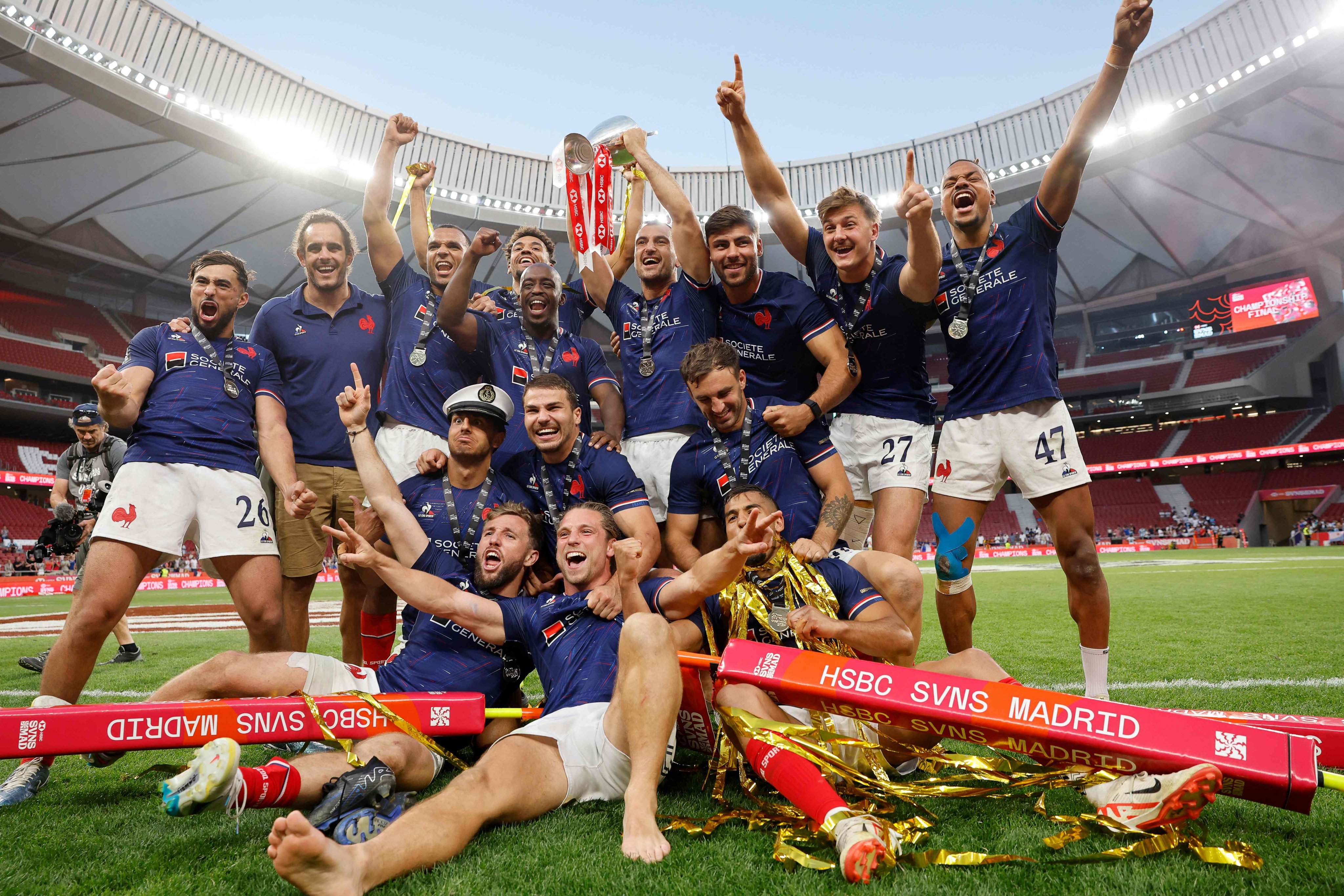 Jubilant France celebrate claiming the HSBC SVNS Series crown in Madrid. Photo: AFP