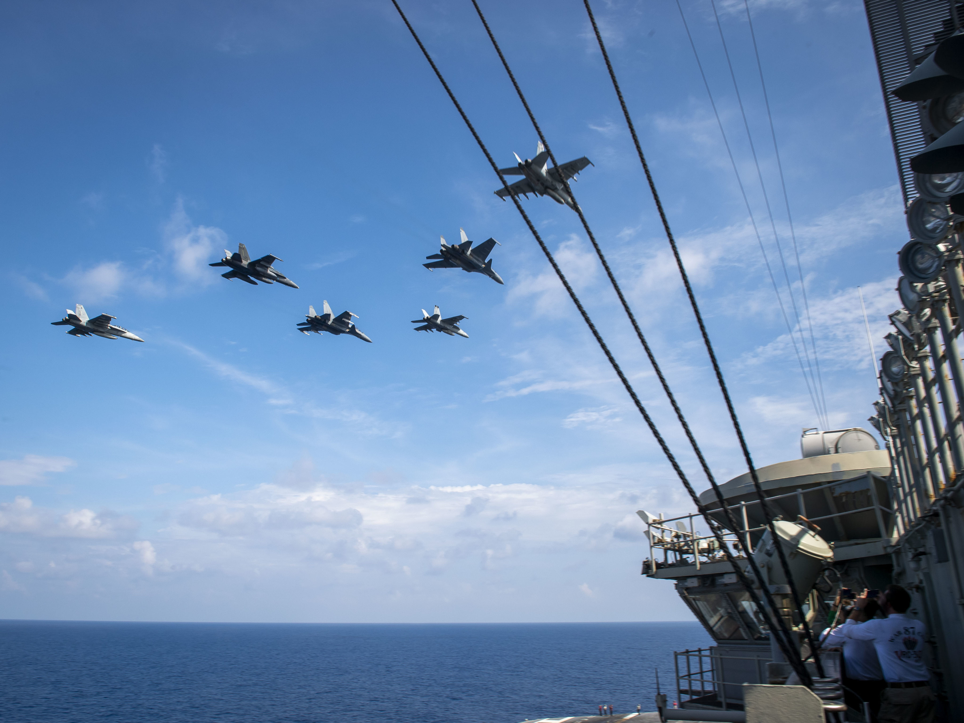 Royal Malaysian Air Force jets fly alongside US aircraft above the USS Theodore Roosevelt carrier during a scheduled deployment to the South China Sea in 2021. Photo US Navy/Handout