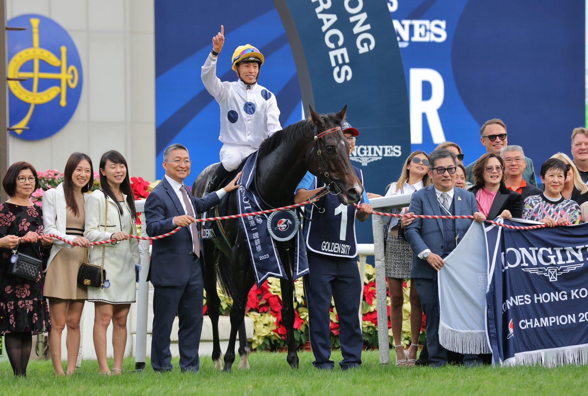 Golden Sixty and connections pose for photos after his third Group One Hong Kong Mile win.