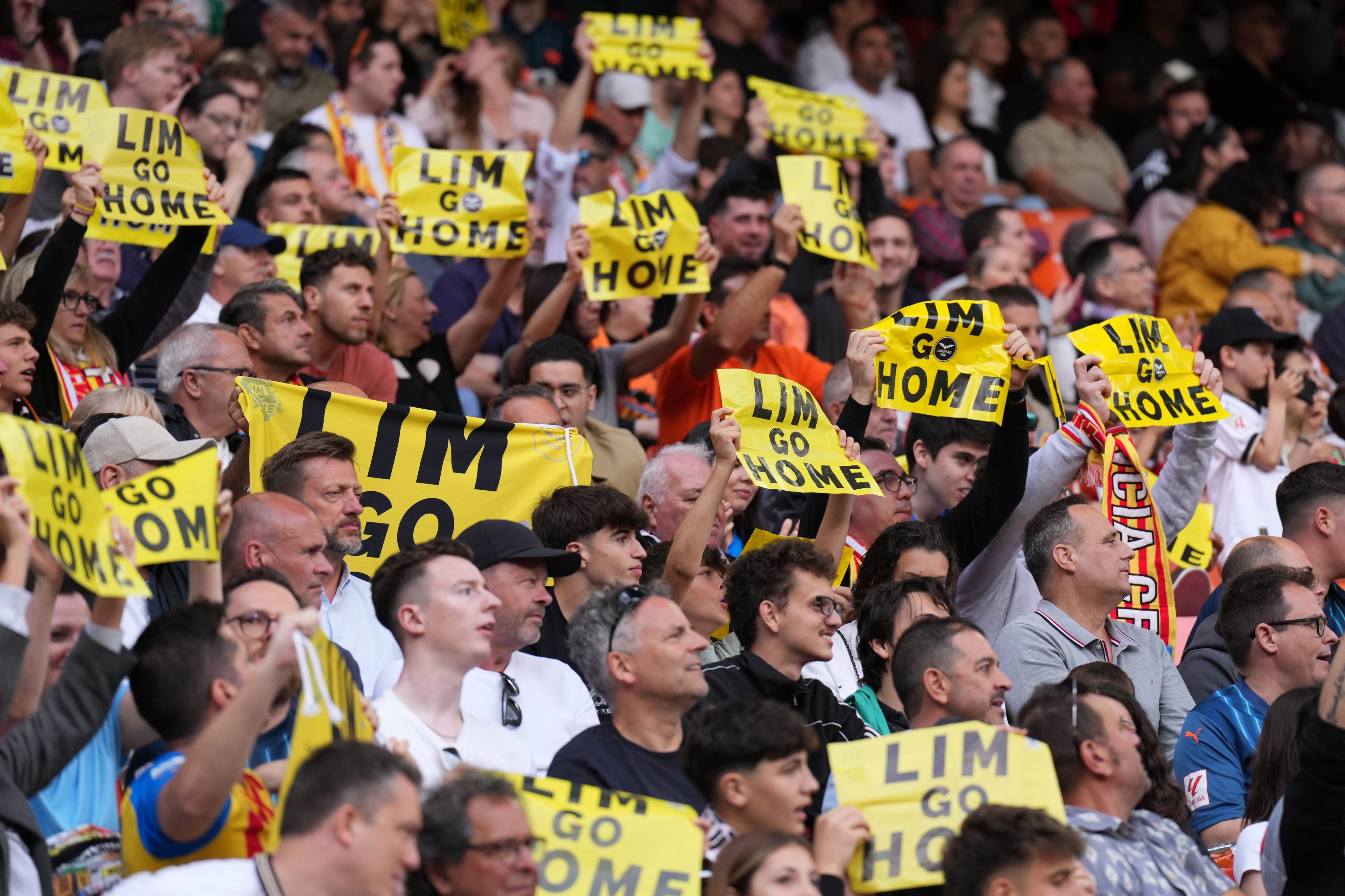 Fans of Valencia CF show protest banners against Peter Lim, Singaporean businessman and club owner, during the La Liga match against Girona at Estadio Mestalla last month. Photo: Getty Images