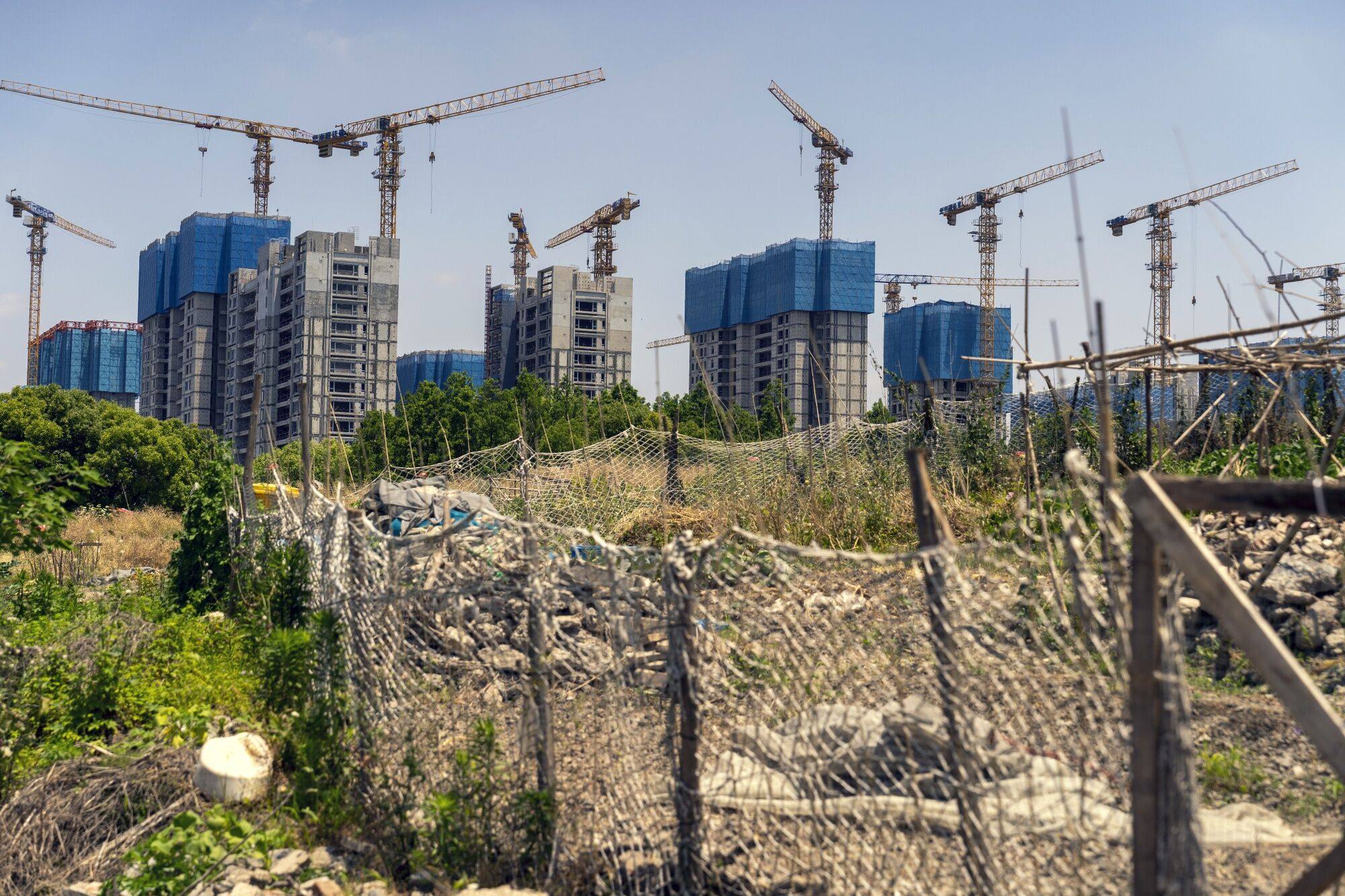 Residential buildings under construction at the China Vanke’s Langshi Flower Language development in Shanghai, China. Photo: Bloomberg