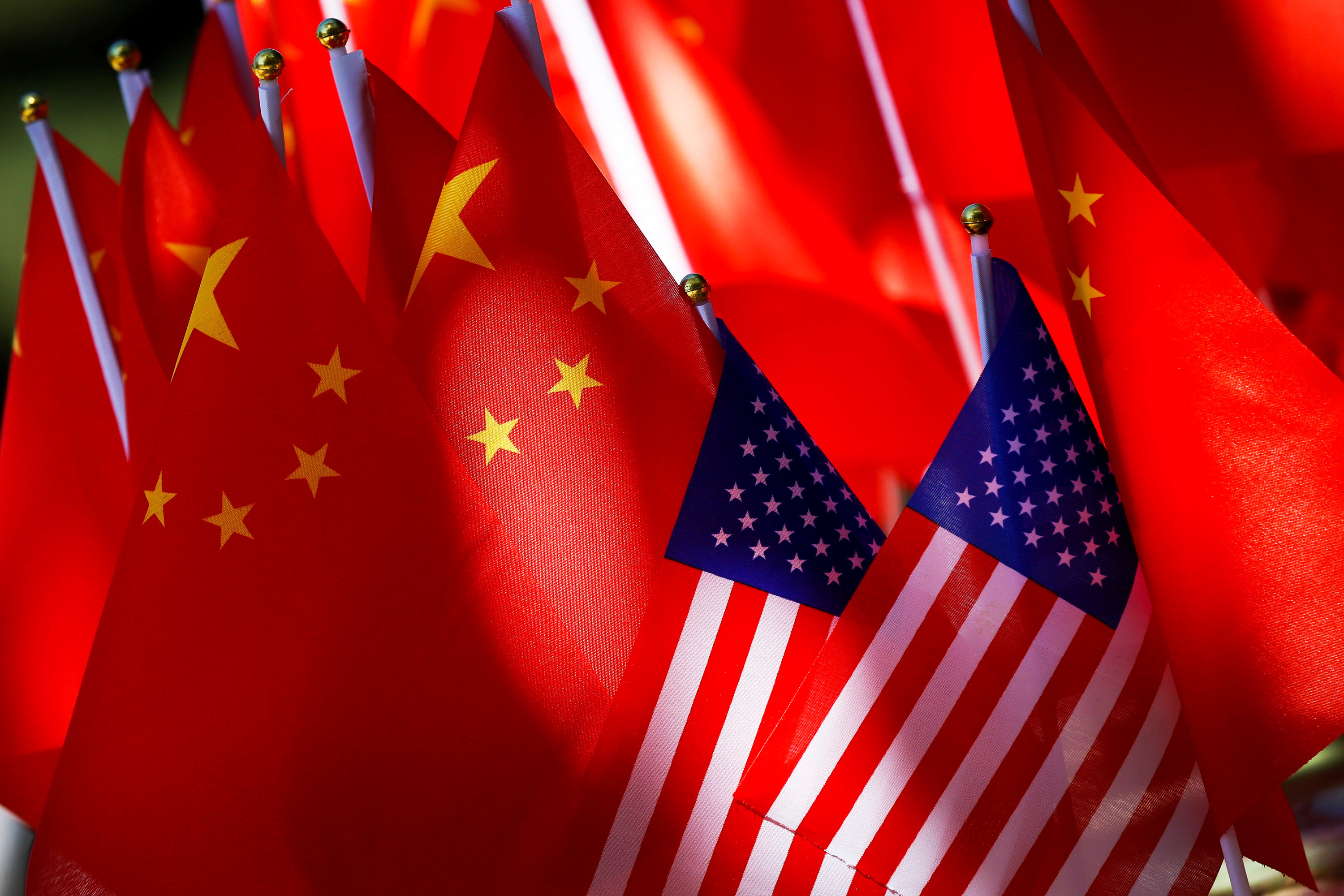 The flags of China and the United States are displayed together in Beijing on September 16, 2018. Photo: AP