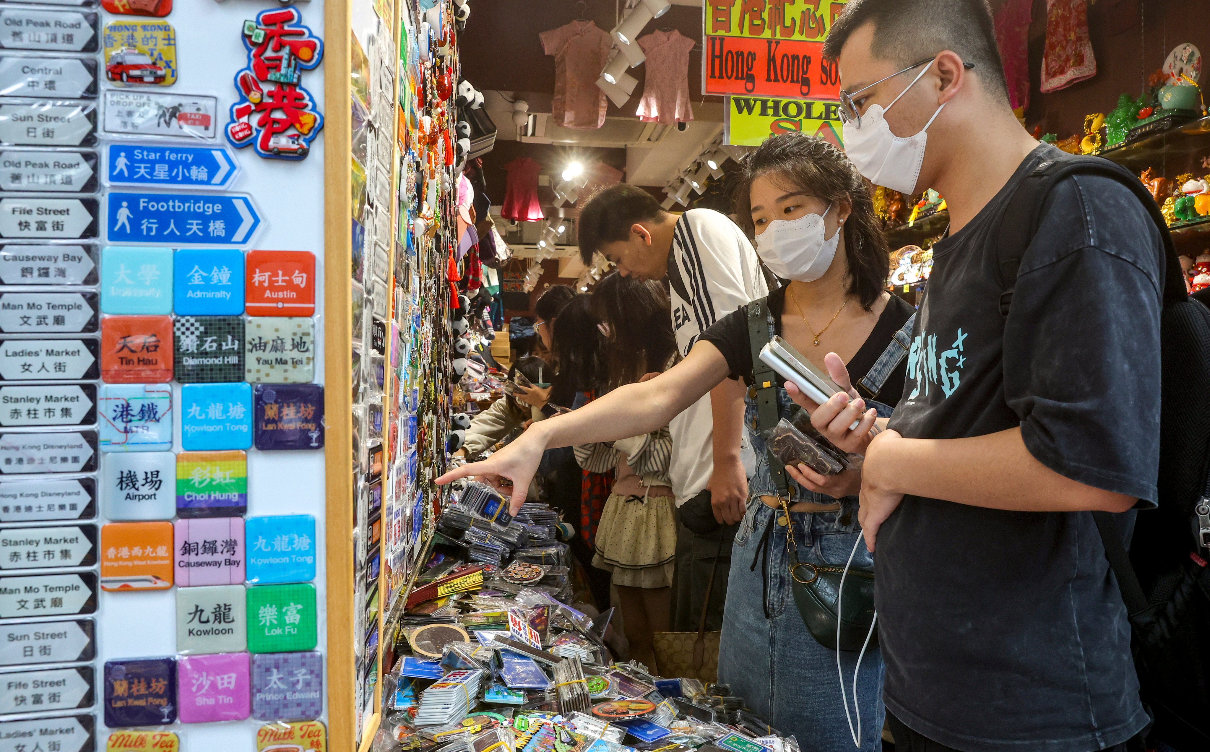 Customers choose souvenirs at a shop in Tsim Sha Tsui. Photo: Edmond So