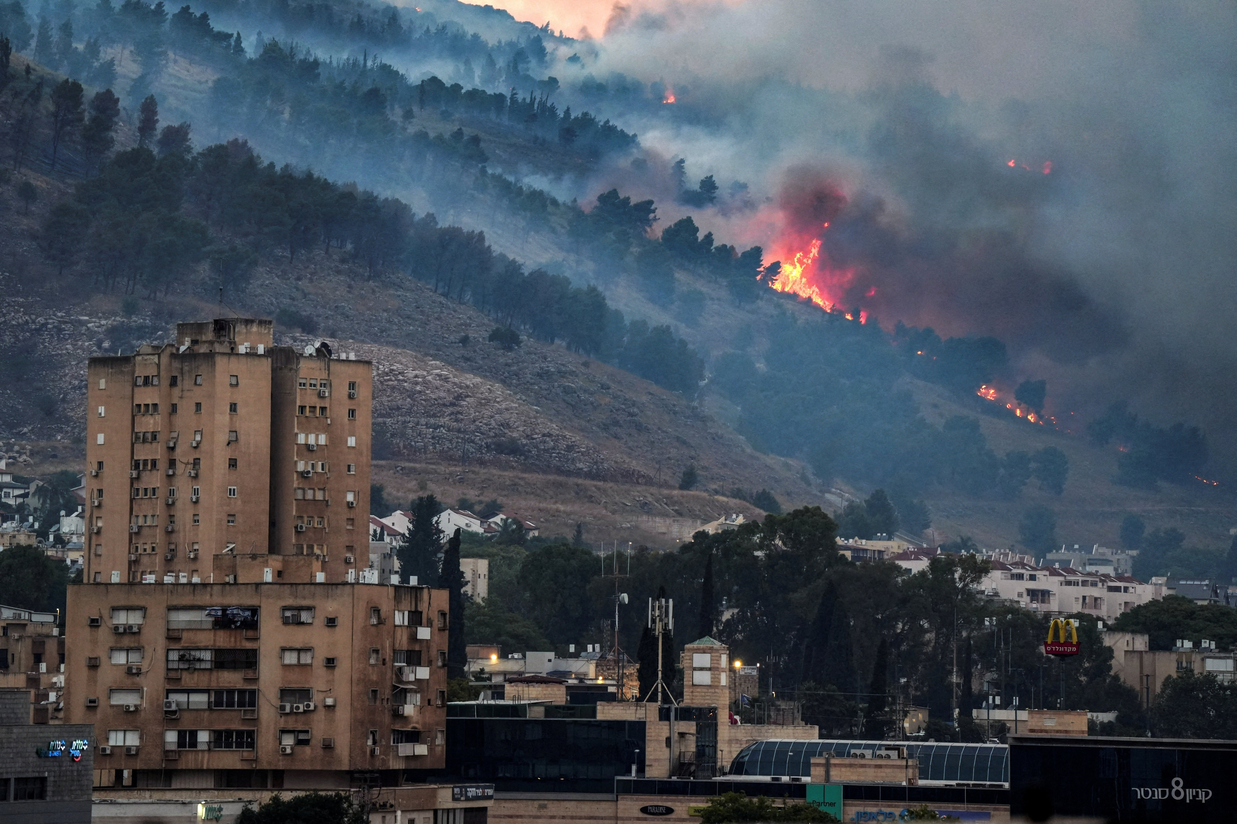 Smoke and fire  near Kiryat Shmona, Israel, following rocket attacks from Lebanon. Photo: Reuters