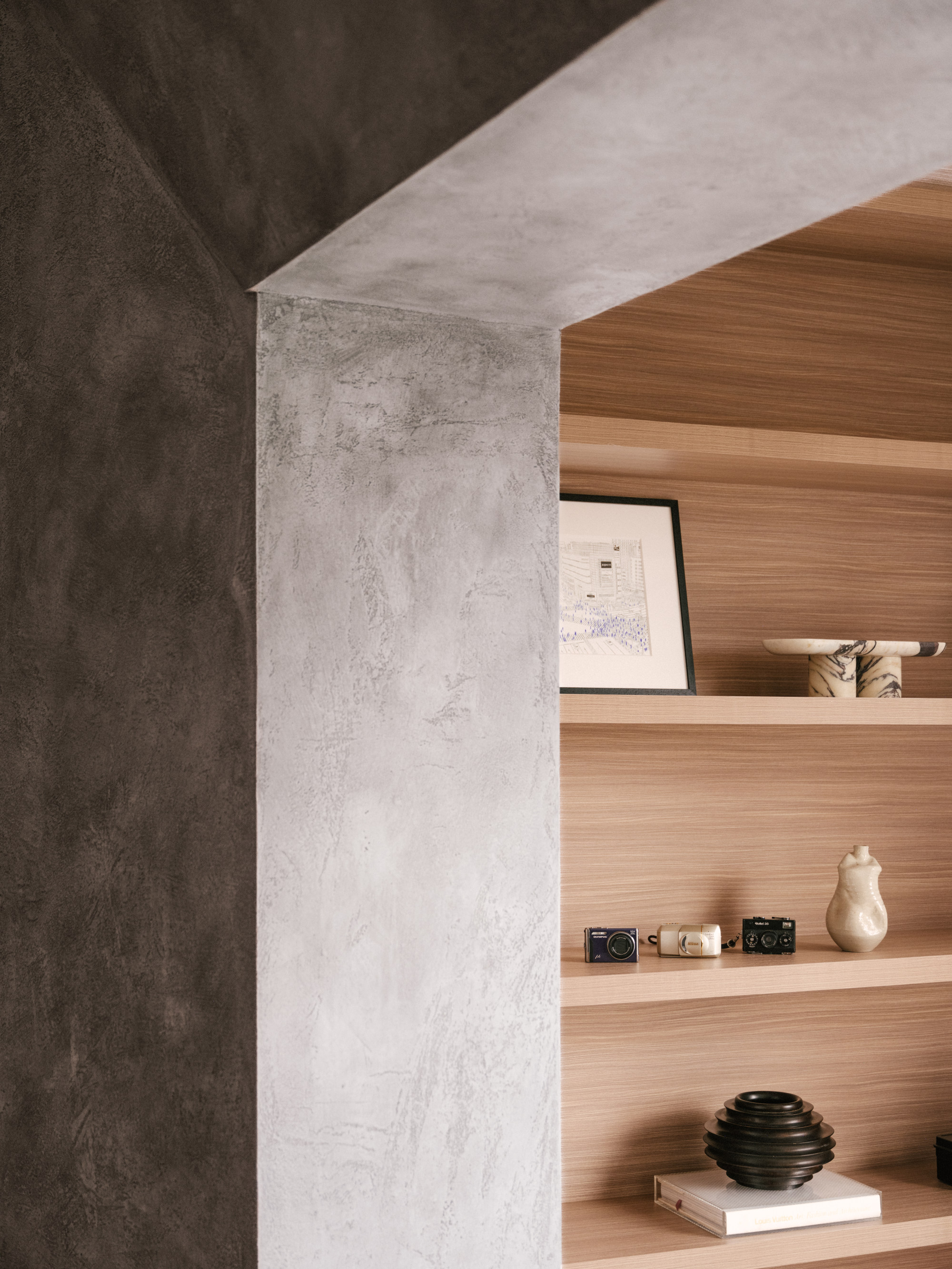 Because solid concrete would have been too heavy, timber formwork supports the portal from the living room to the yoga room. Photo: Common Studio