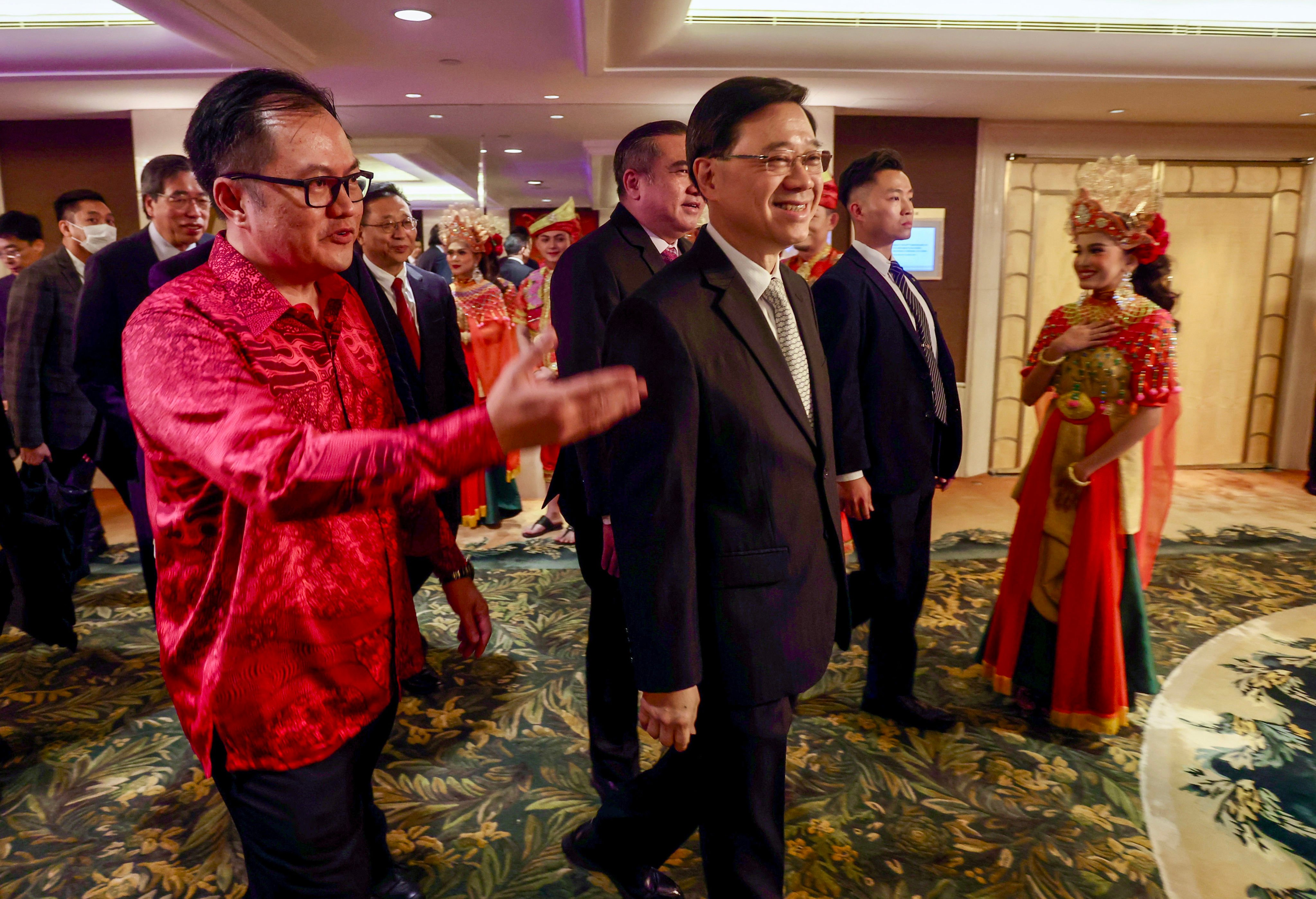 Malaysian Consul General Muzambli Markam (left) welcomes Chief Executive John Lee to Thursday’s reception. Photo: Jonathan Wong