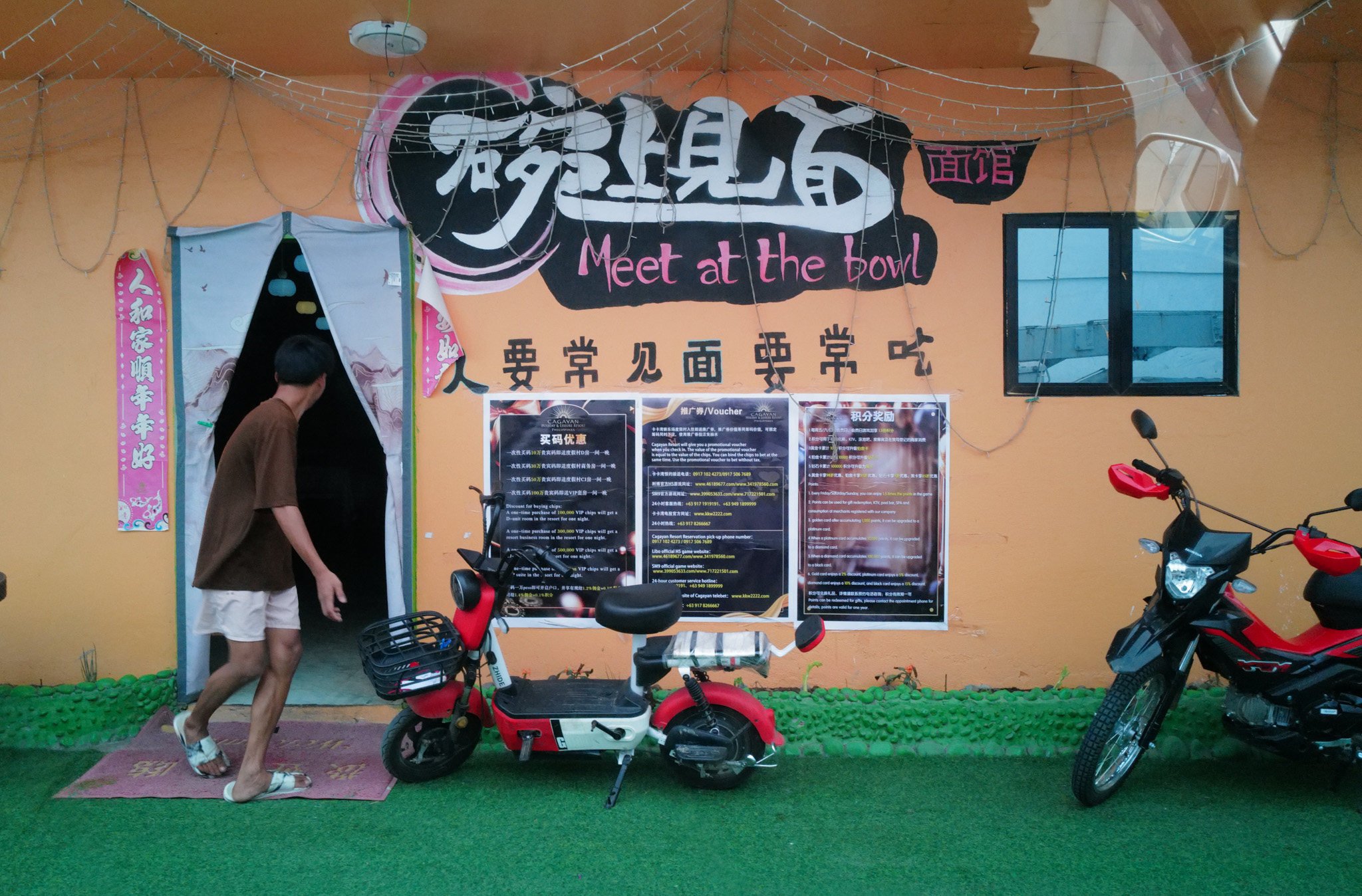 A man exits a Chinese restaurant in Santa Ana, near the Philippines’ northernmost EDCA site used by US forces. Photo: Jeoffrey Maitem