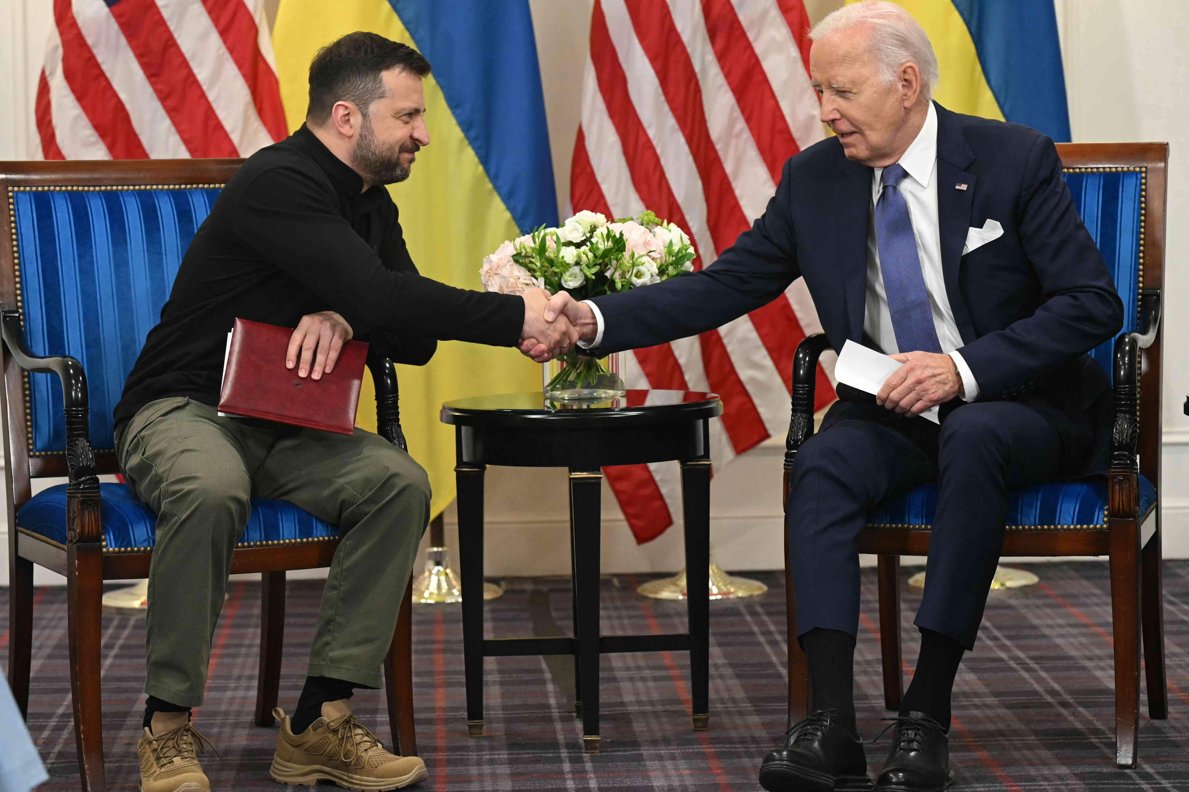 US President Joe Biden (right) shakes hands with Ukraine’s President Volodymyr Zelensky as they hold a bilateral meeting in Paris. Biden pledged his support for Ukraine and announced another US$225 million in aid to Kyiv. Photo: AFP