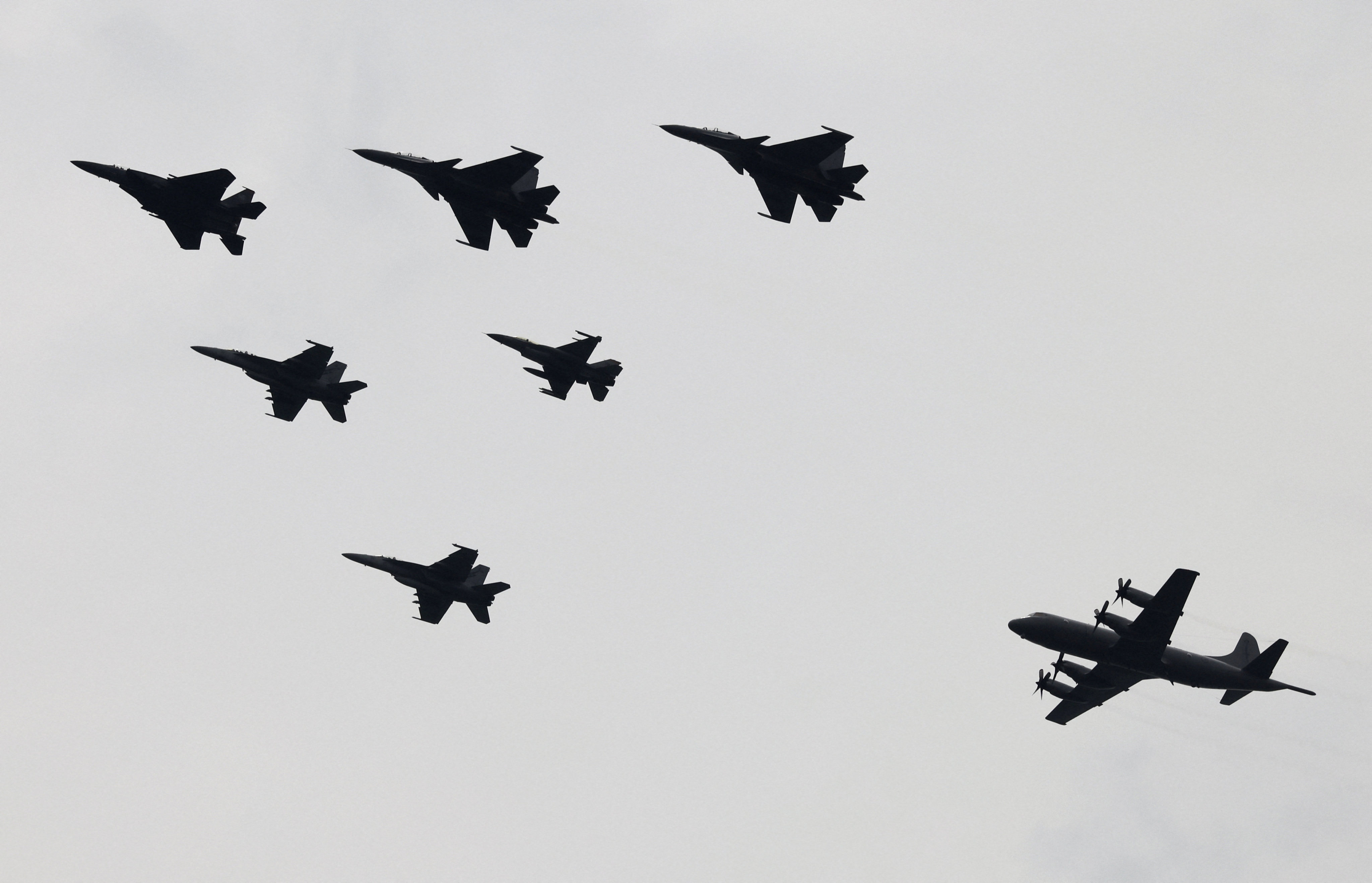 Military aircraft from Malaysia, Singapore, Australia and New Zealand fly in formation to commemorate the 50th anniversary of the Five Power Defence Arrangements in 2021. Photo: Reuters