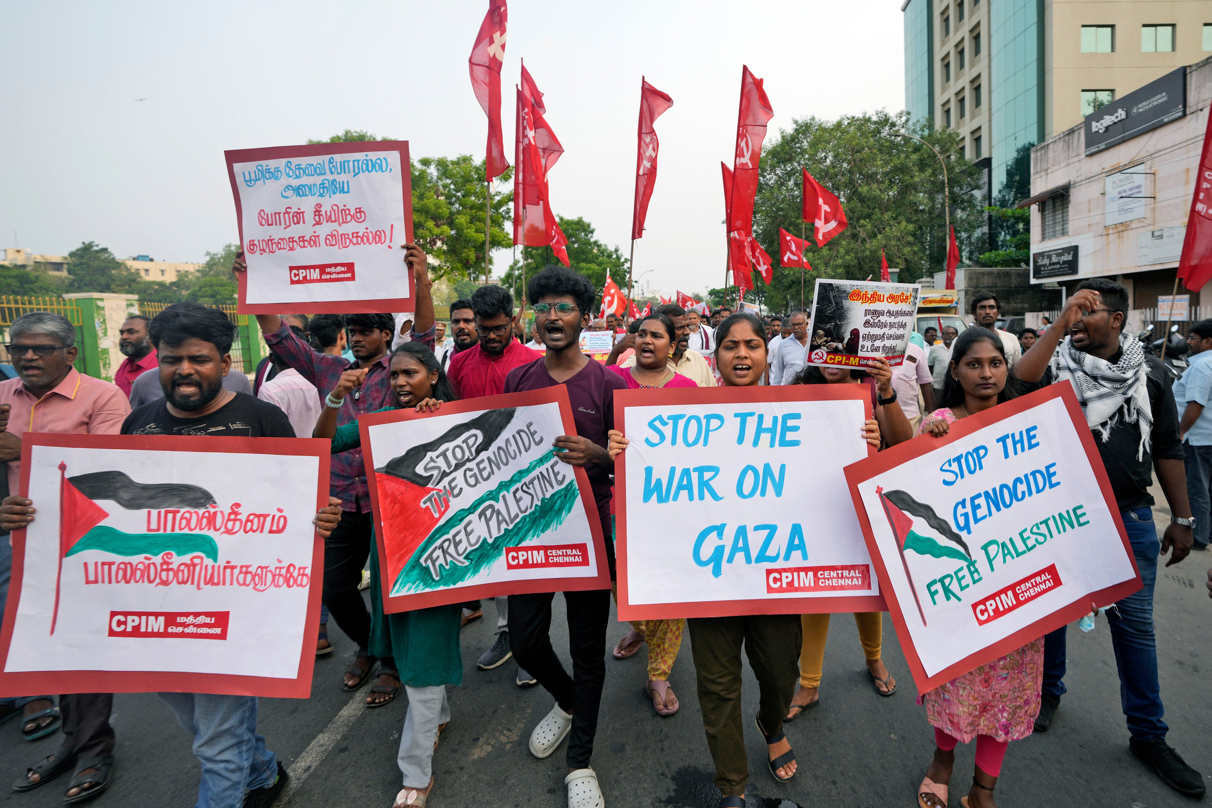 Indians carry placards as they participate in a foot march in Chennai to protest the war in Gaza and to show solidarity with the people of Palestine. Photo: AP