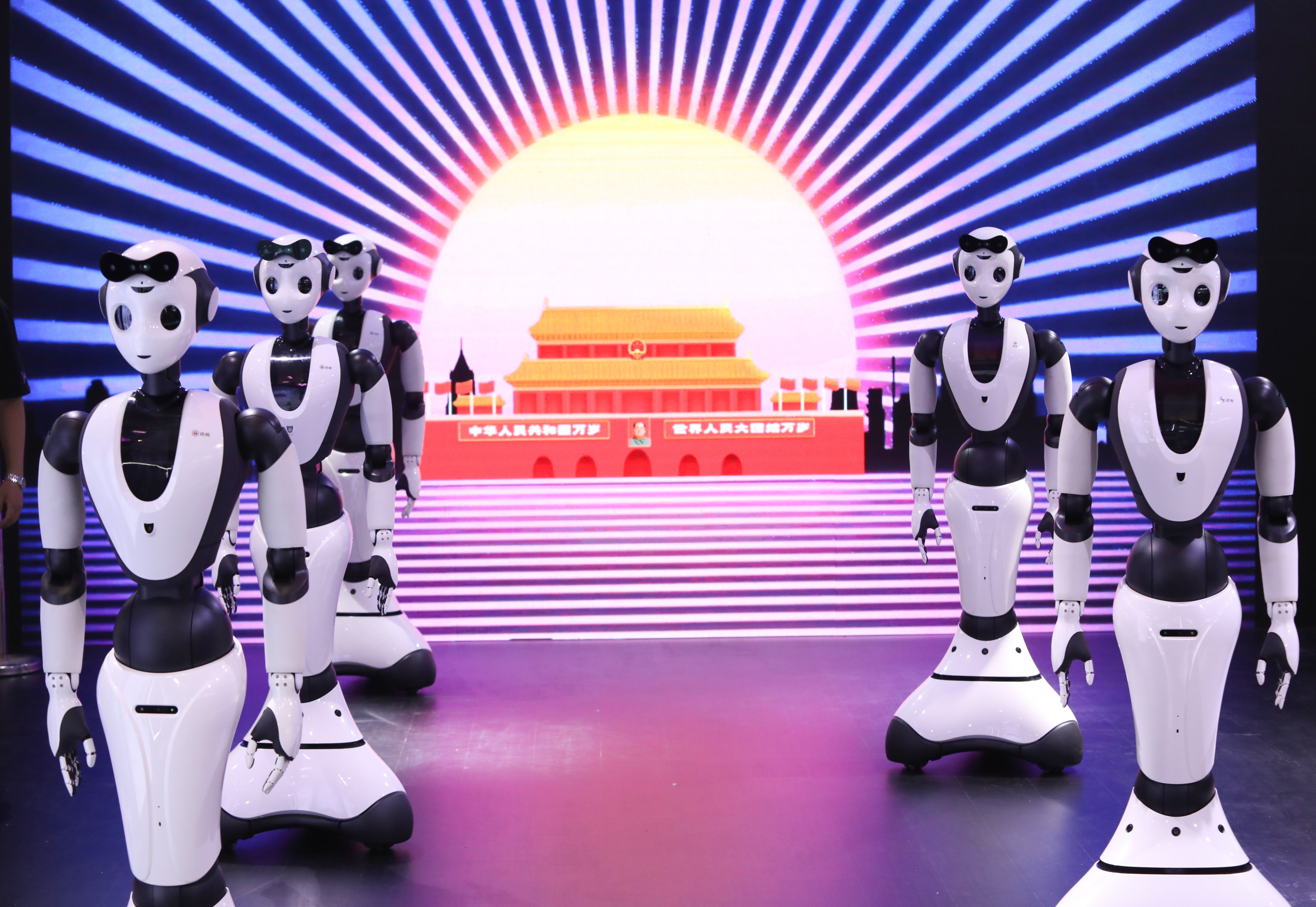 Robots perform at the 2023 World Robot Conference in Beijing last August. Chinese cities and provinces have ramped up development of new sectors such as artificial intelligence. Photo: Simon Song