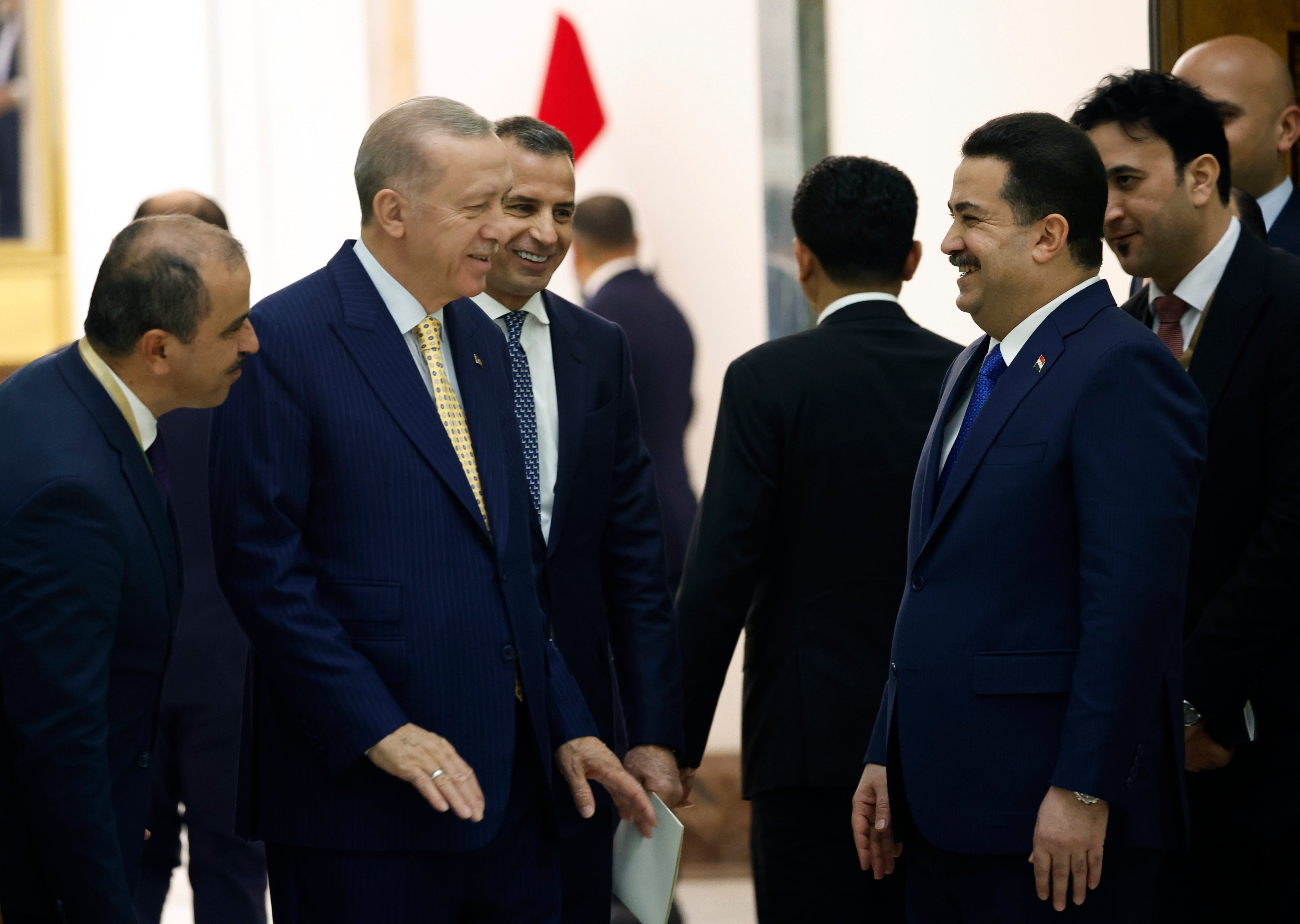 Turkish President Recep Tayyip Erdogan (second left) and Iraqi Prime Minister Mohammed Shia al-Sudani (foreground, right) attend the ceremony to sign a four-way memorandum of understanding between Iraq, Turkey, Qatar and the UAE to cooperate in the Development Road project, in Baghdad, Iraq, on April 22. Photo: AP