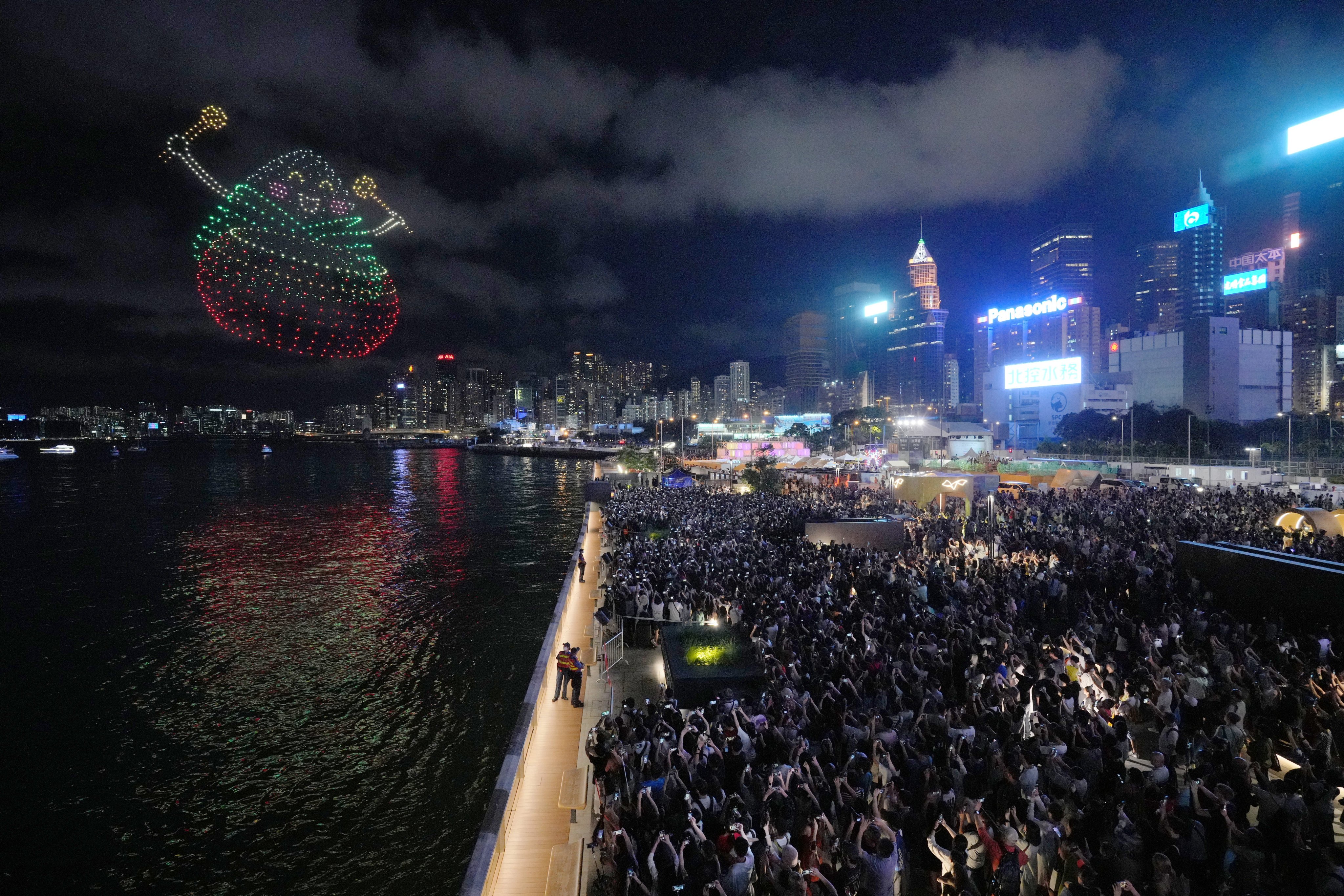 Crowds gathered on Monday evening at the the Wan Chai harbourfront for the drone show. Photo: May Tse