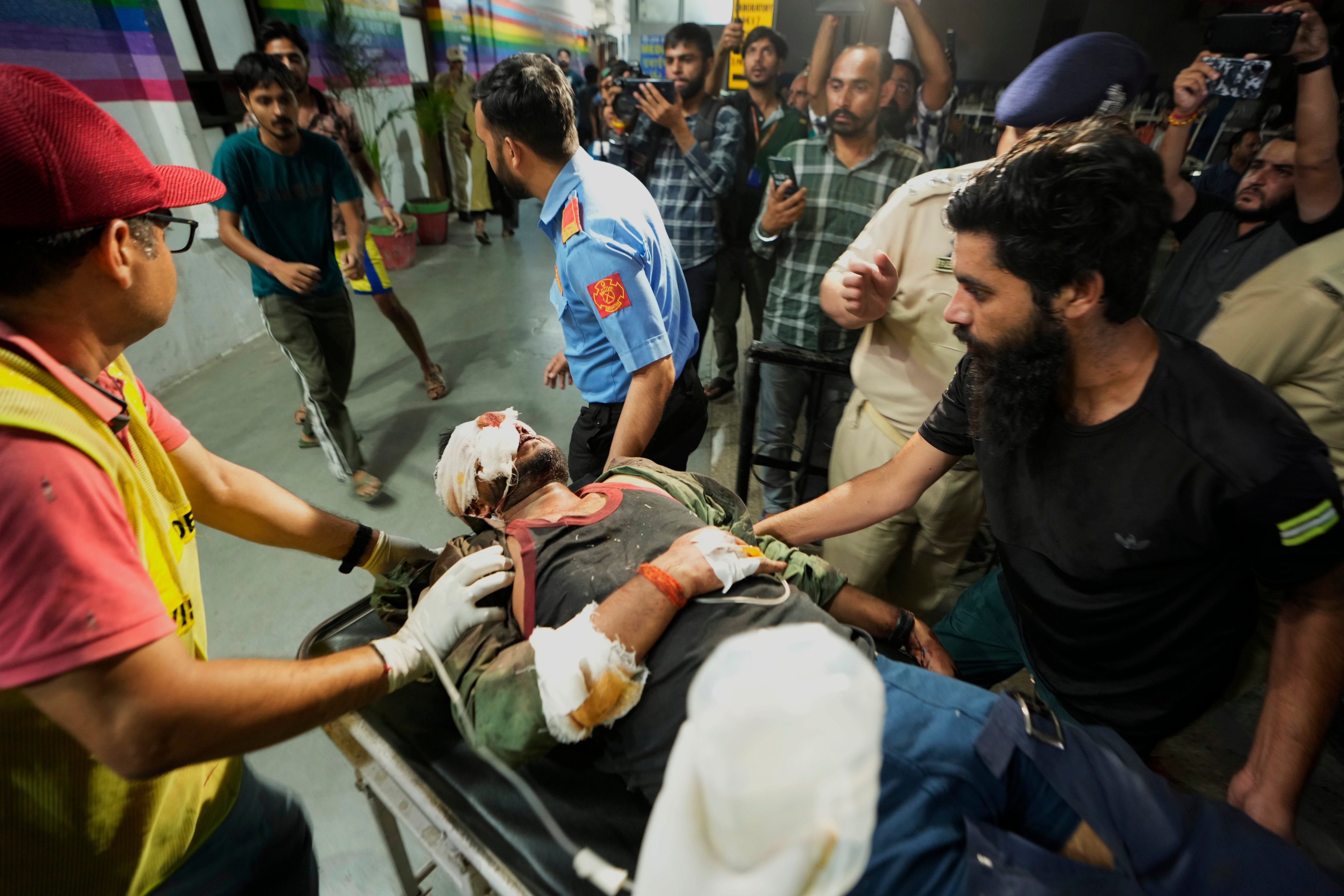 An injured man is brought to the Government Medical College Hospital in Jammu after a bus crash in the Pouni area of Jammu’s Reasi district, India on Sunday. Photo: AP
