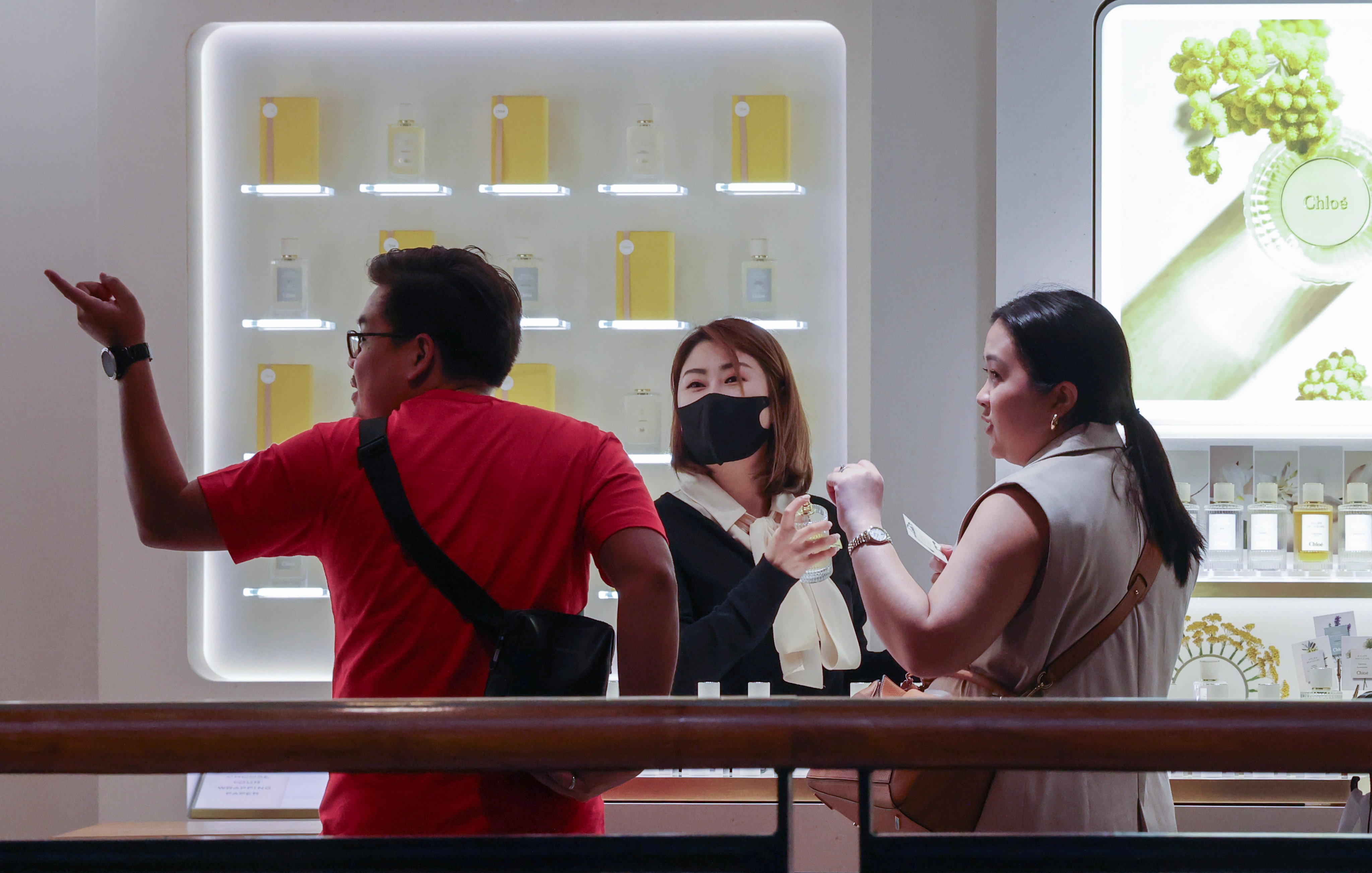 Store staff serving customers at a shopping centre in Tsim Sha Tsui on June 4. Hong Kong retailers have been struggling as local shoppers flock to the mainland for bargains while mainlanders are turning to Hainan as their top luxury shopping destination. Photo: Jelly Tse