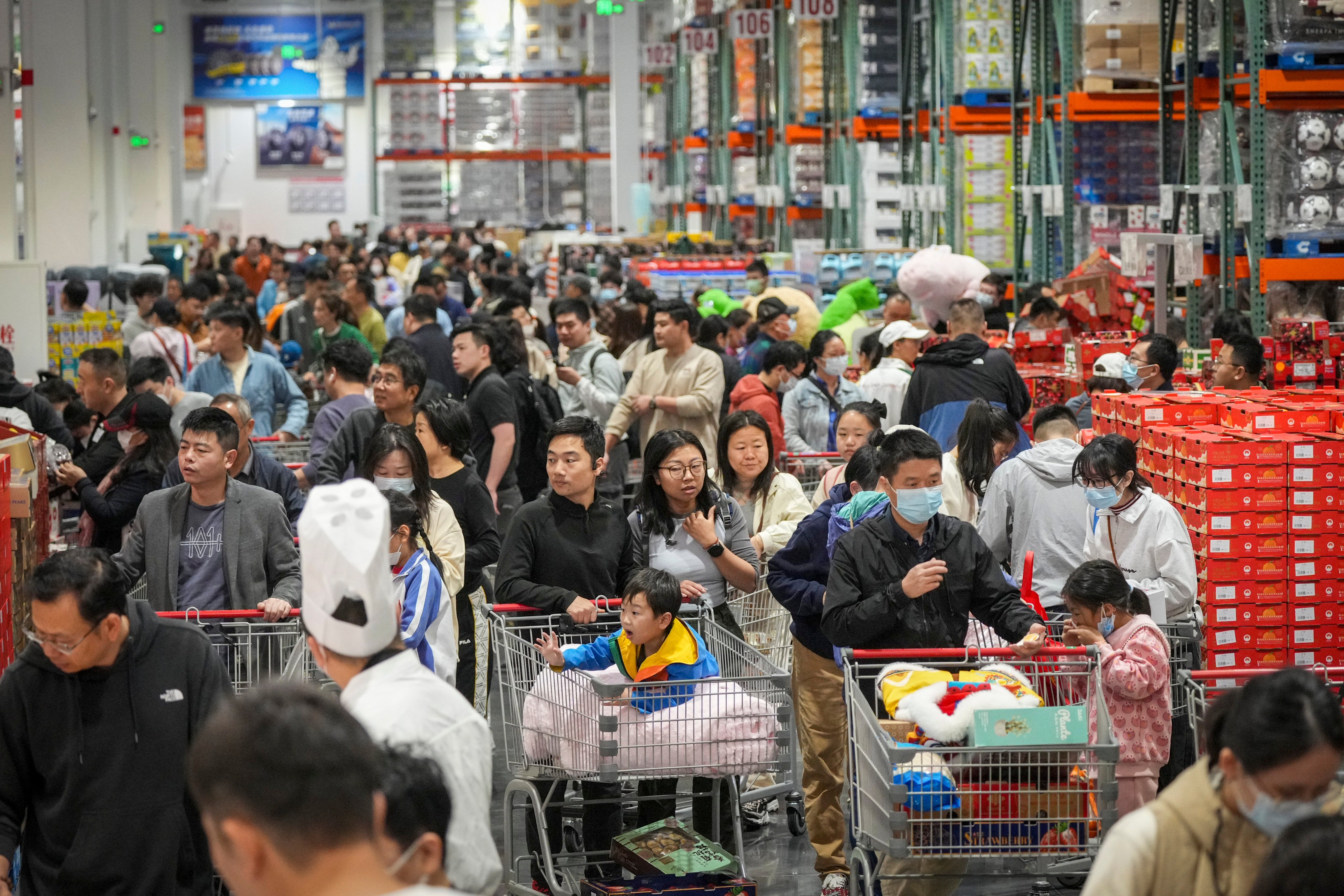 Hongkongers and Shenzhen residents flock to the new Costco which has opened in the bay area city. Photo: Eugene Lee