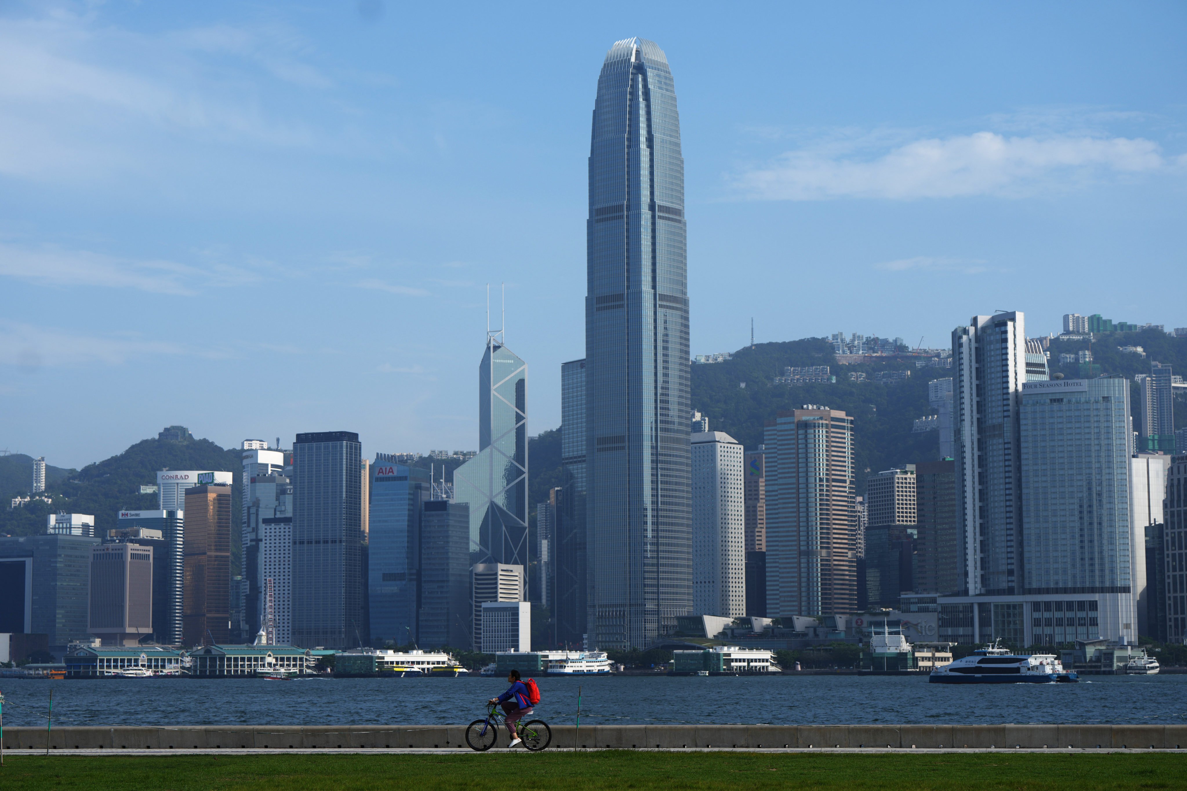 A cyclists rides through West Kowloon overlooking Victoria Harbour and Hong Kong’s financial district on May 16. Photo: Sam Tsang
