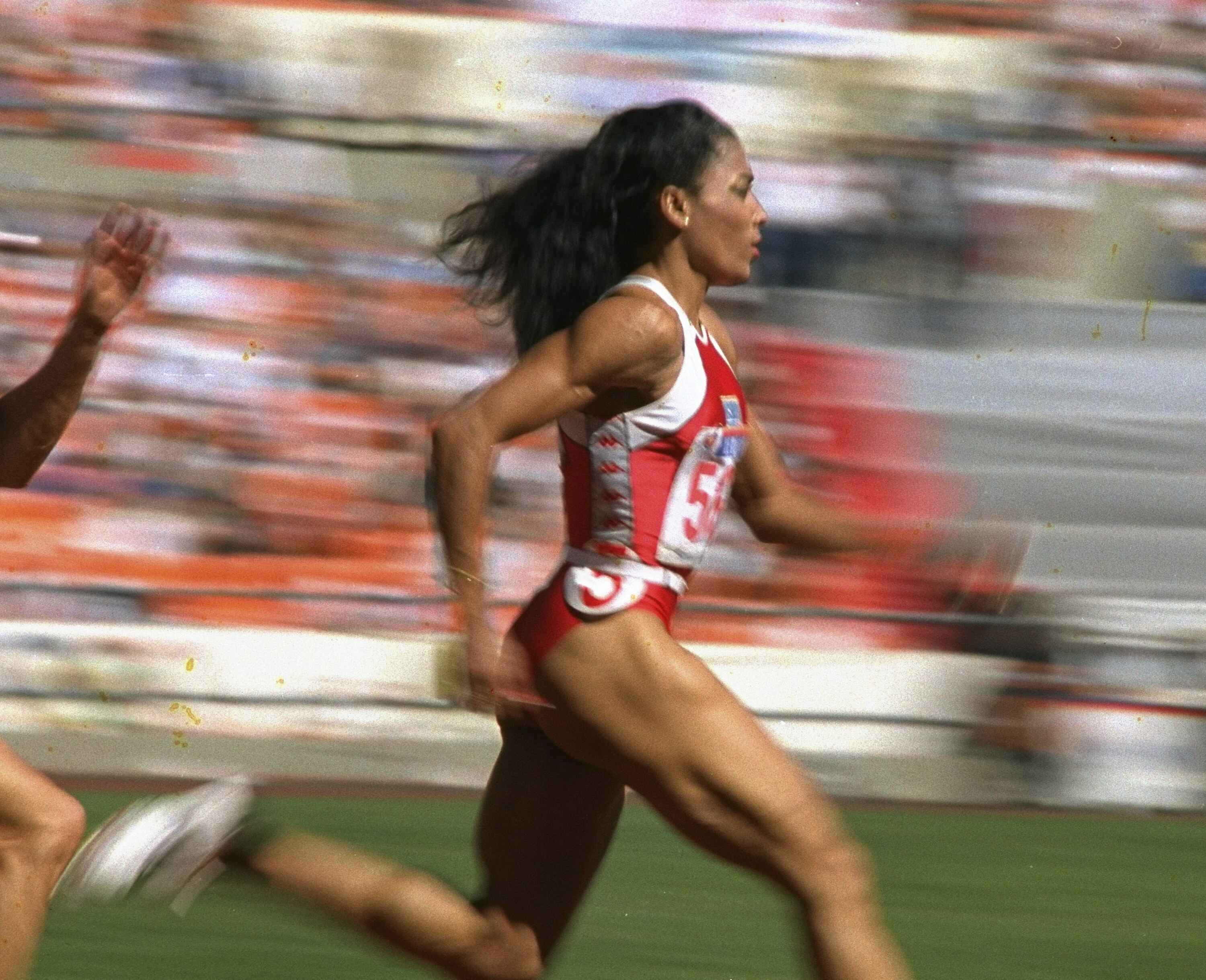 US sprinter Florence Griffith Joyner strides to a world record in a semifinal heat of the Olympic women’s 200 metres in Seoul in 1988. Photo: AP