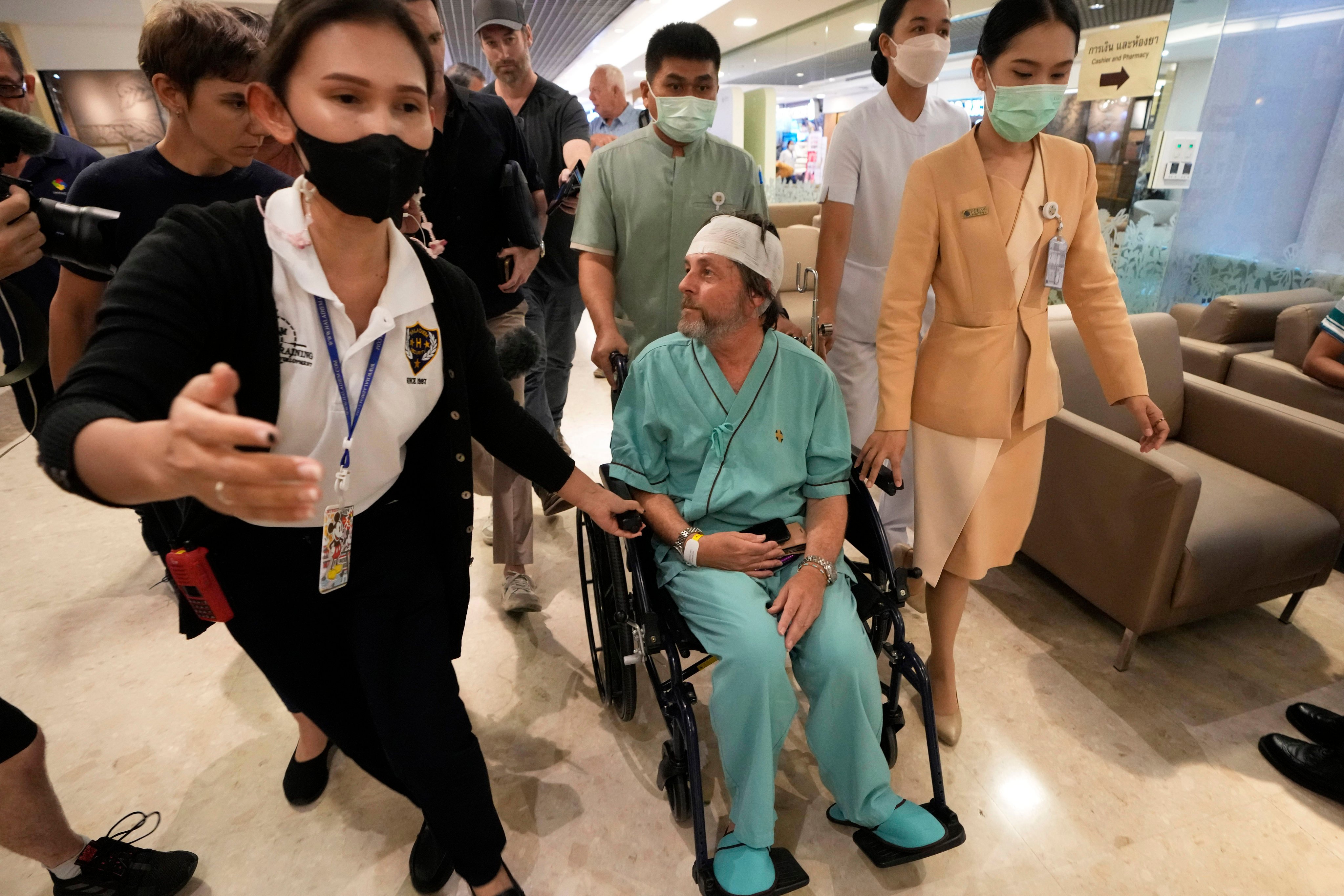 An Australian passenger who was injured on Singapore Airlines Flight SQ321 is seen at a hospital in Bangkok on May 23. Photo: AP
