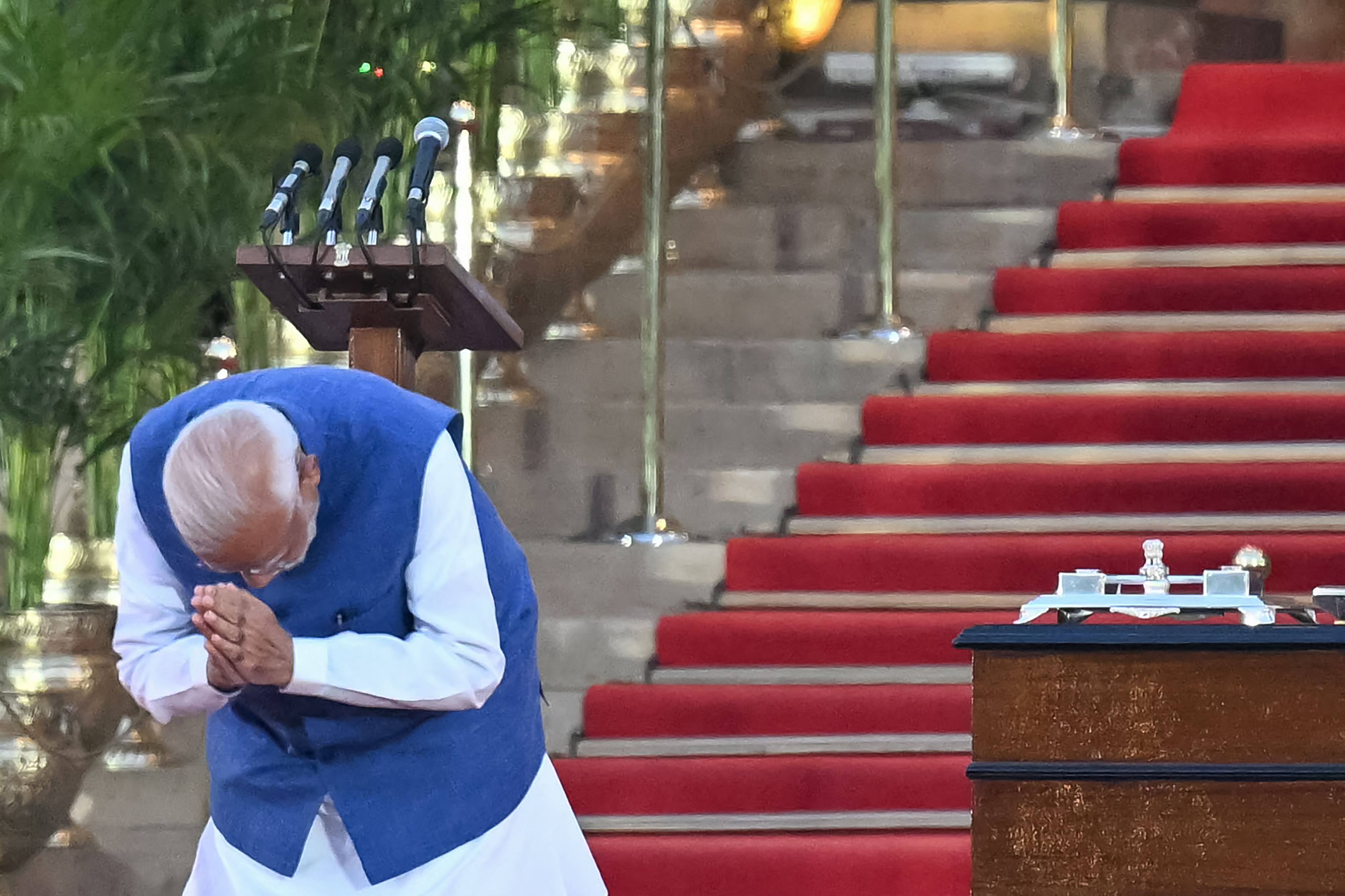 India’s Bharatiya Janata Party leader Narendra Modi bows to the gathering before taking the oath of office for a third term as the country’s prime minister at the ceremony at the presidential palace in New Delhi on June 9. Photo: AFP