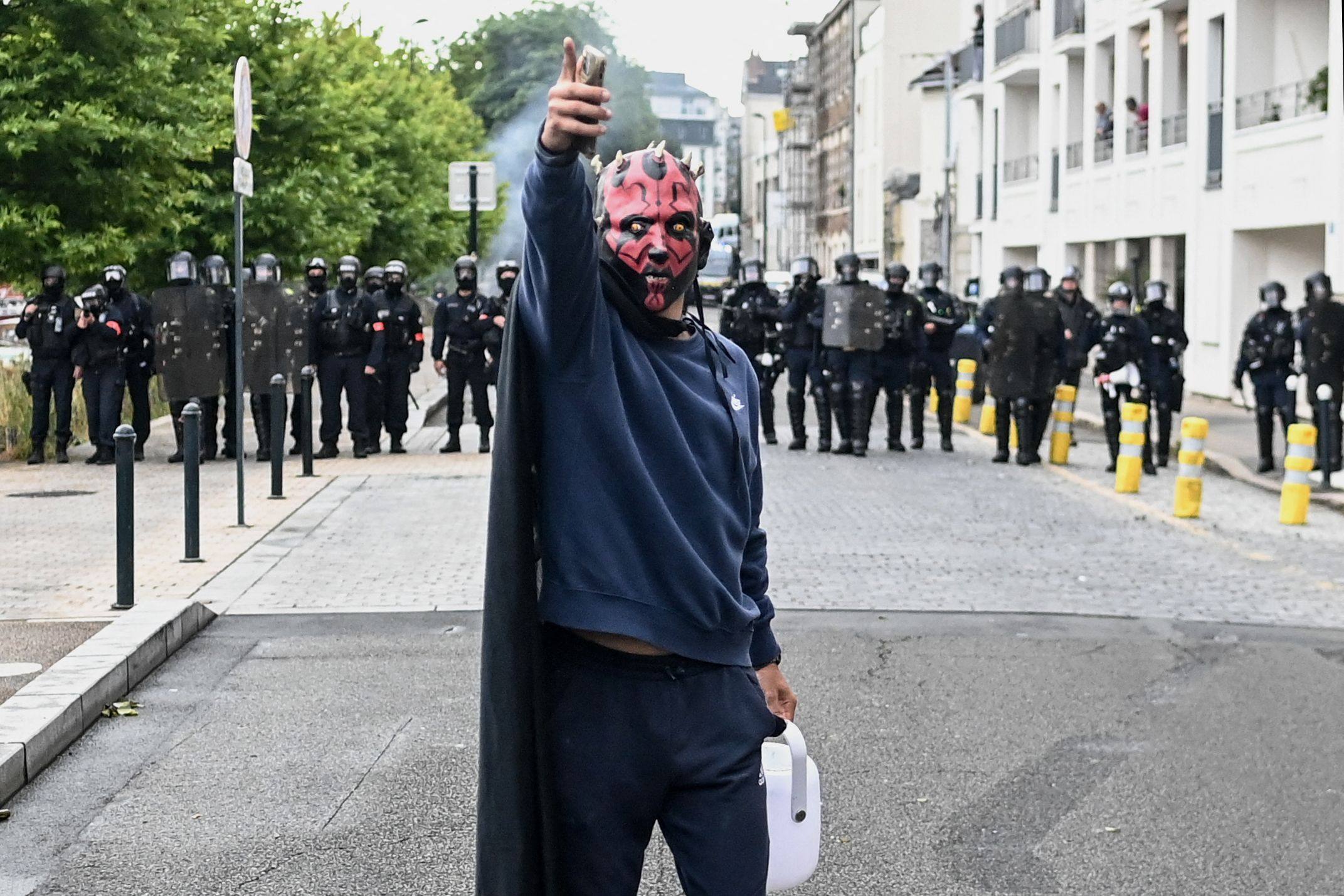 A protestor in Nantes, western France demonstrates against the far-right National Rally party after their success in the European elections. Photo: AFP