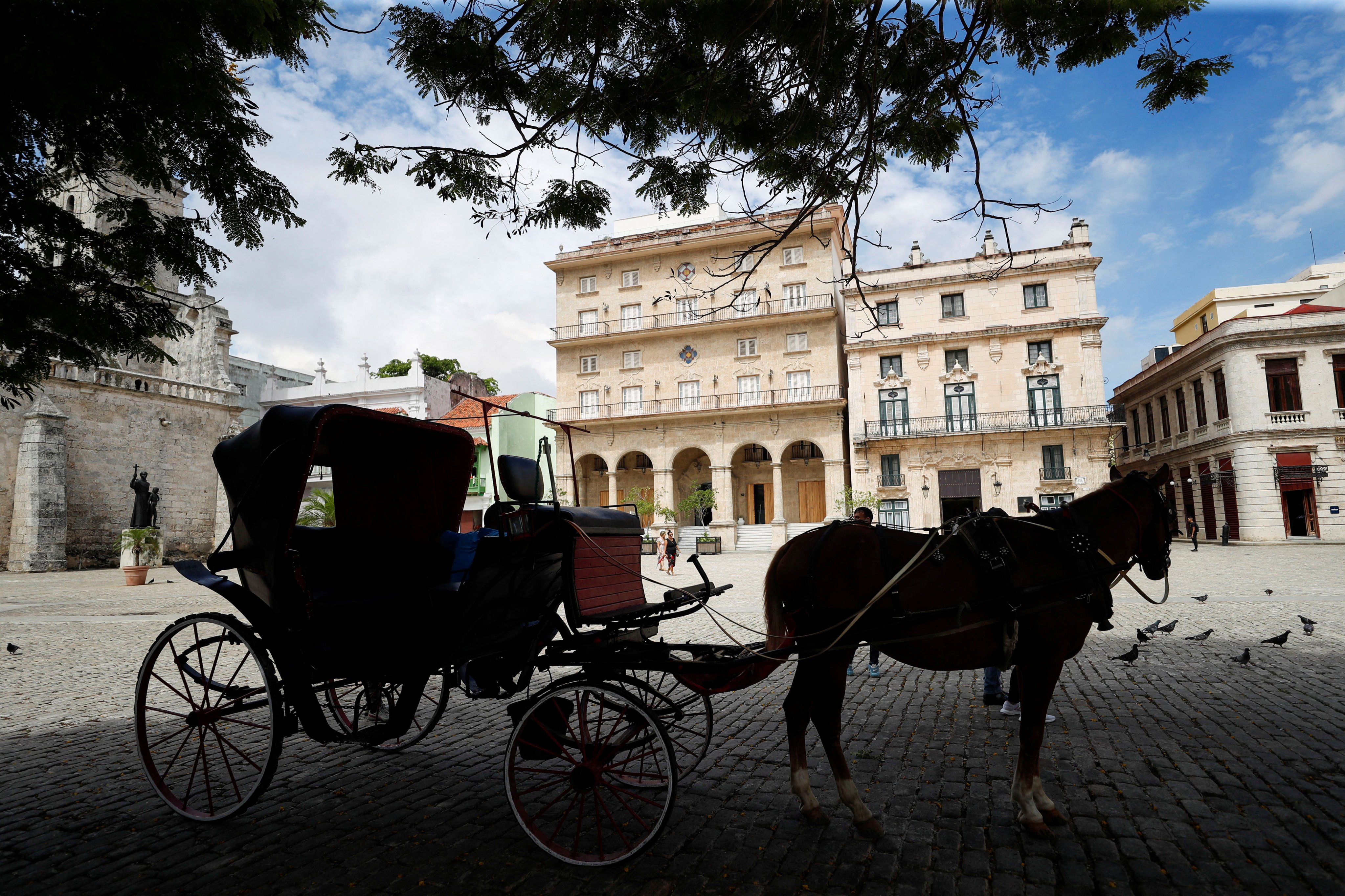 A horse-drawn carriage waits for tourists in a square in Havana, Cuba. The country has seen a sharp decline in visitors from the US and Europe and is trying to make up for this by wooing Chinese and Russian tourists. Photo: Reuters