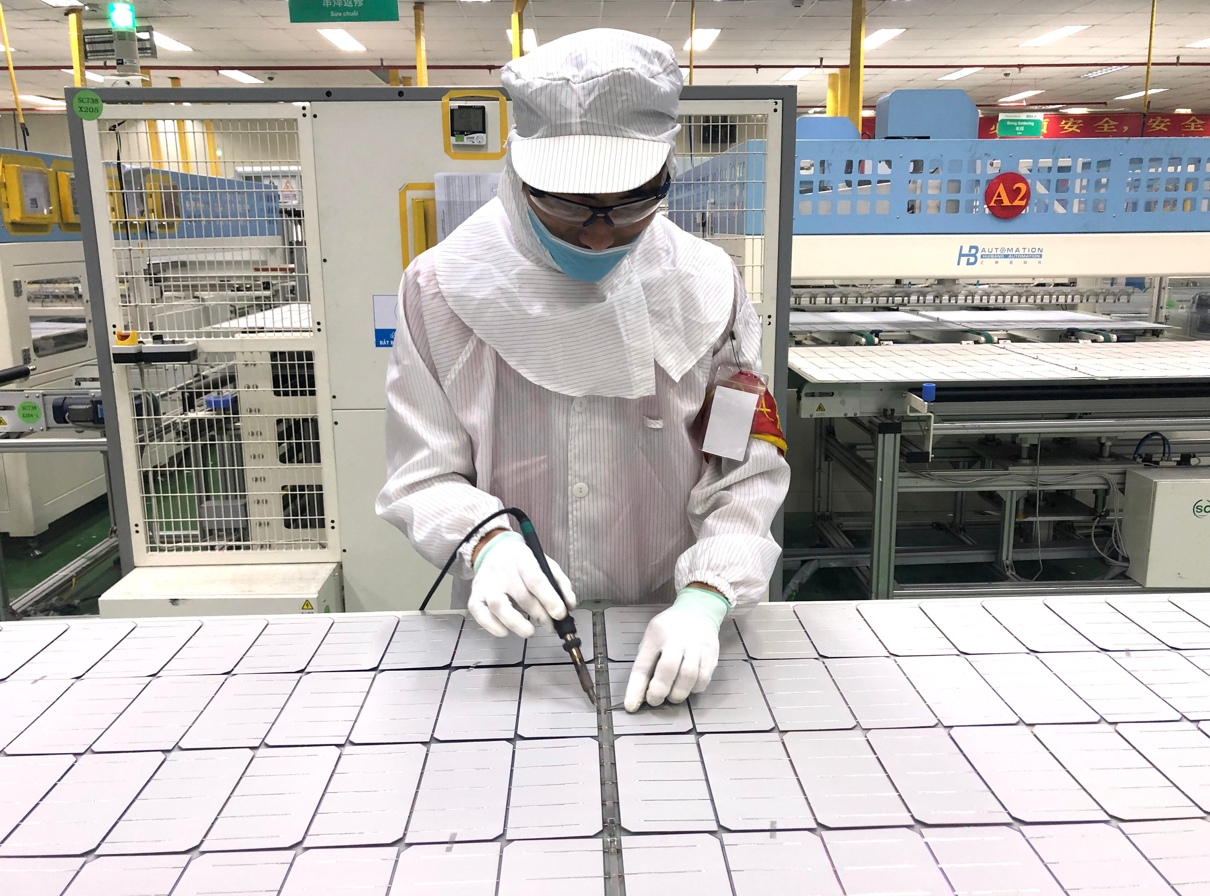 A worker on the production line at a Vinasolar plant in Ho Chi Minh City. Solar equipment manufacturing in Vietnam and other Southeast Asian countries has come under scrutiny amid accusations of Chinese manufacturers moving operations there to dodge US tariffs. Photo: Cissy Zhou