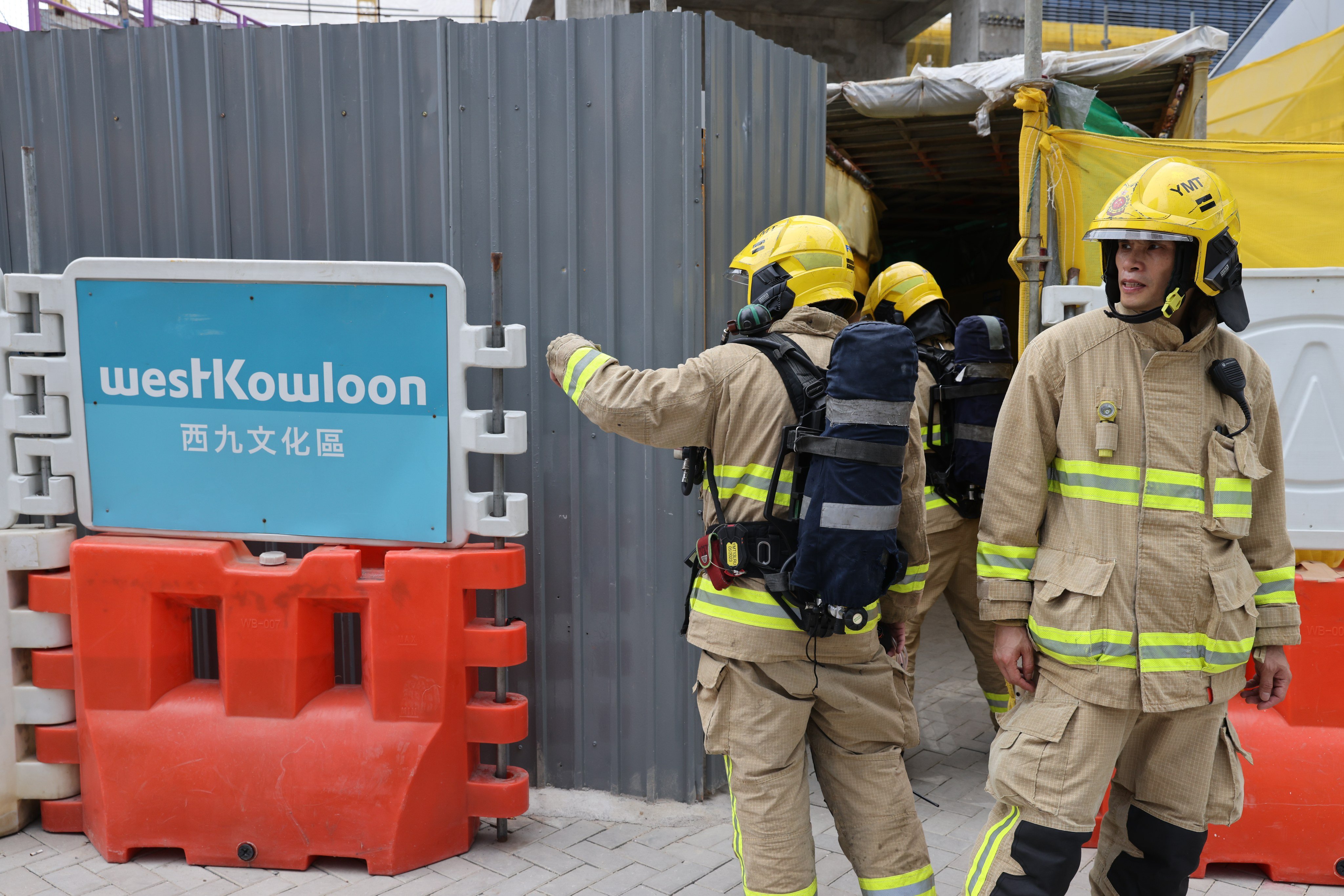 Firefighters at the Lyric Theatre construction site in West Kowloon after two workers were found dead in a gas-filled underground chamber. Photo: Yik Yeung-man