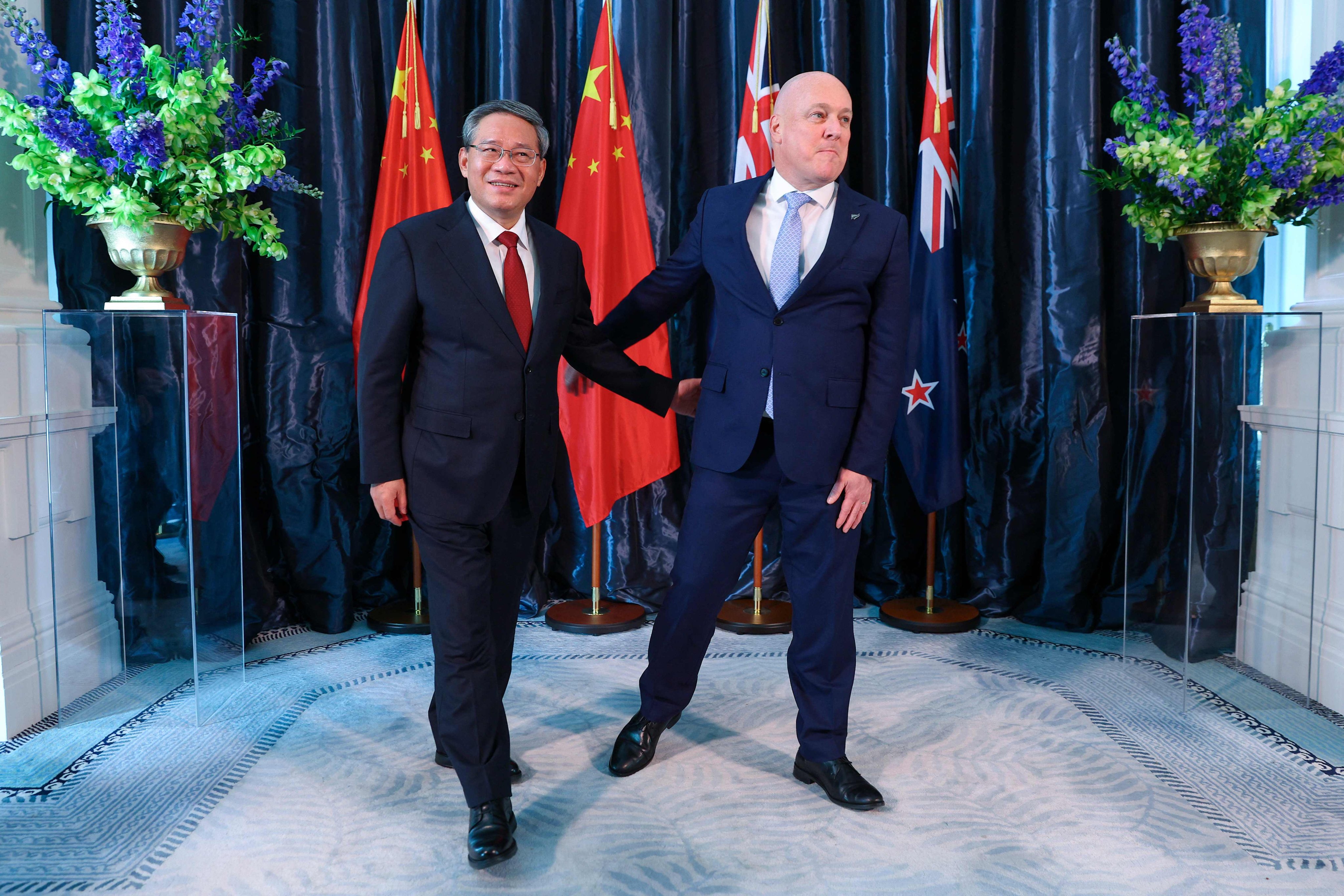 New Zealand’s Prime Minister Christopher Luxon (right) with Chinese Premier Li Qiang at Government House in Wellington on June 13. Photo: AFP