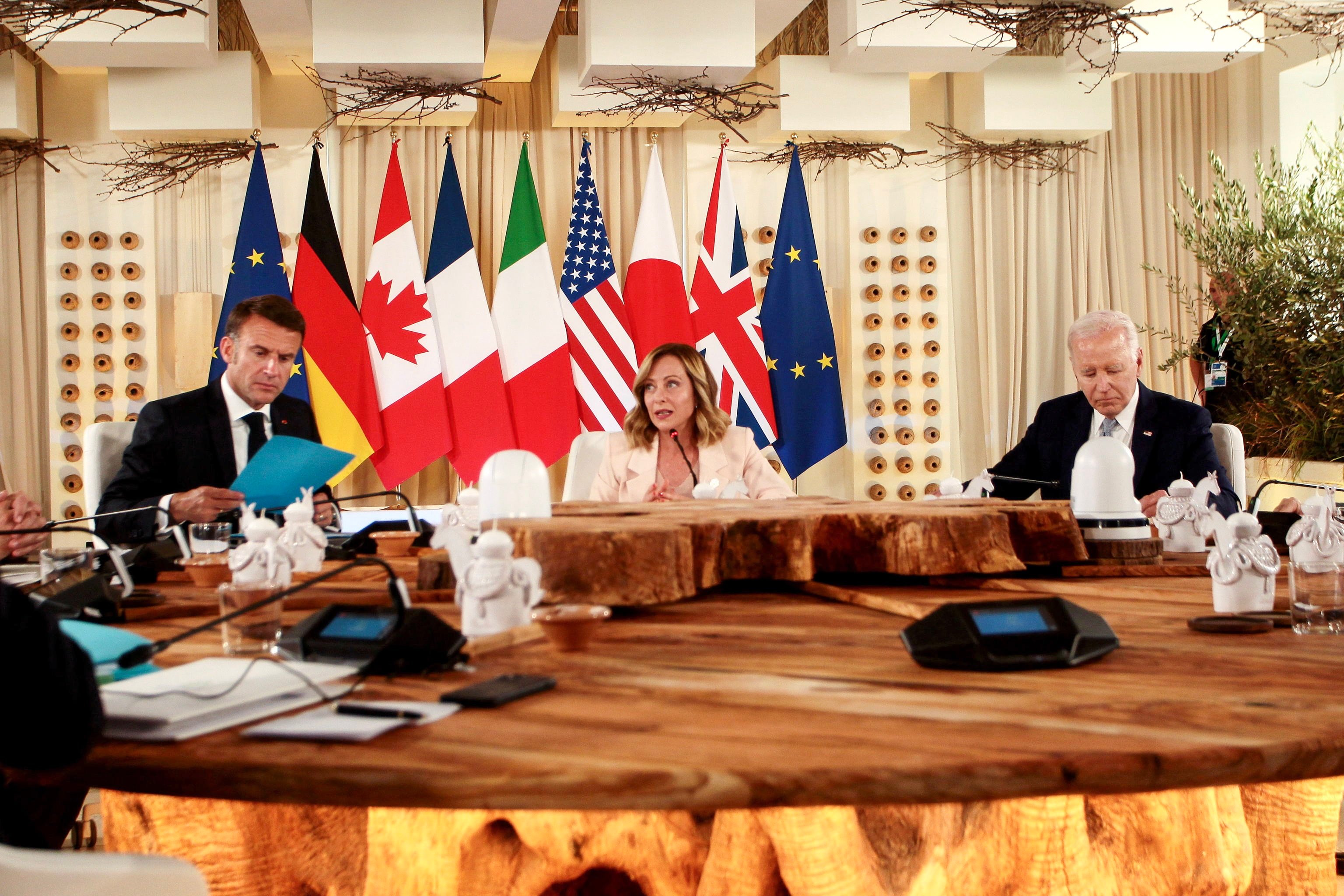 From left:French President Emmanuel Macron, Italian Prime Minister Giorgia Meloni and US President Joe Biden attend a round table meeting at the G7 summit in Borgo Egnazia, Italy on Thursday. Photo: EPA-EFE