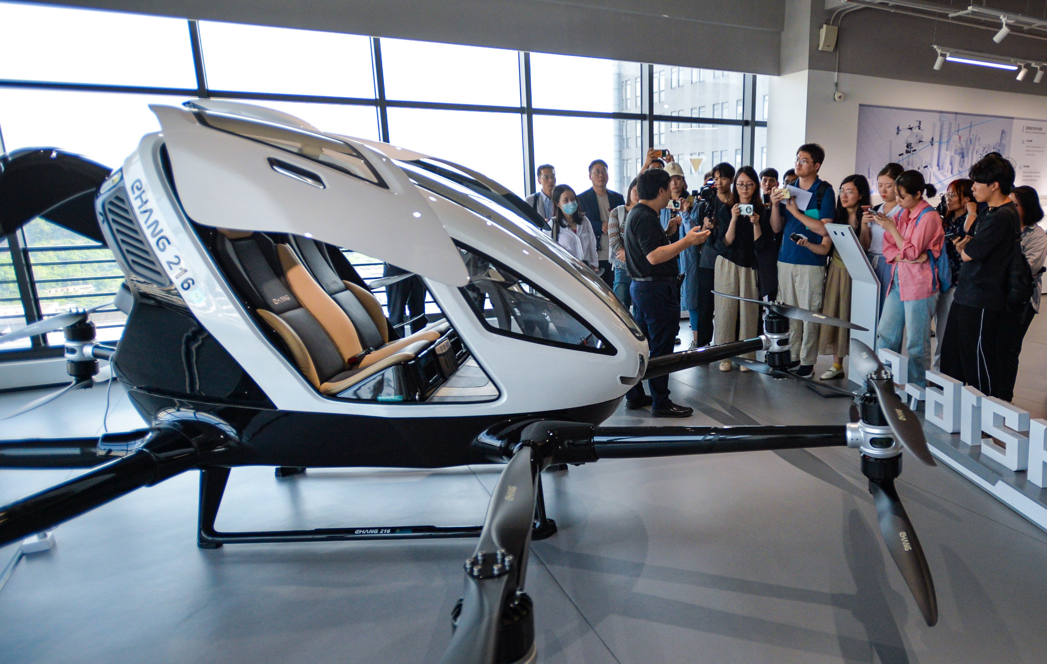 A pilotless passenger drone on display in Guangzhou. One lawmaker has said Hong Kong could use the uncrewed aircraft to take tourists on sightseeing flights. Photo: Xinhua